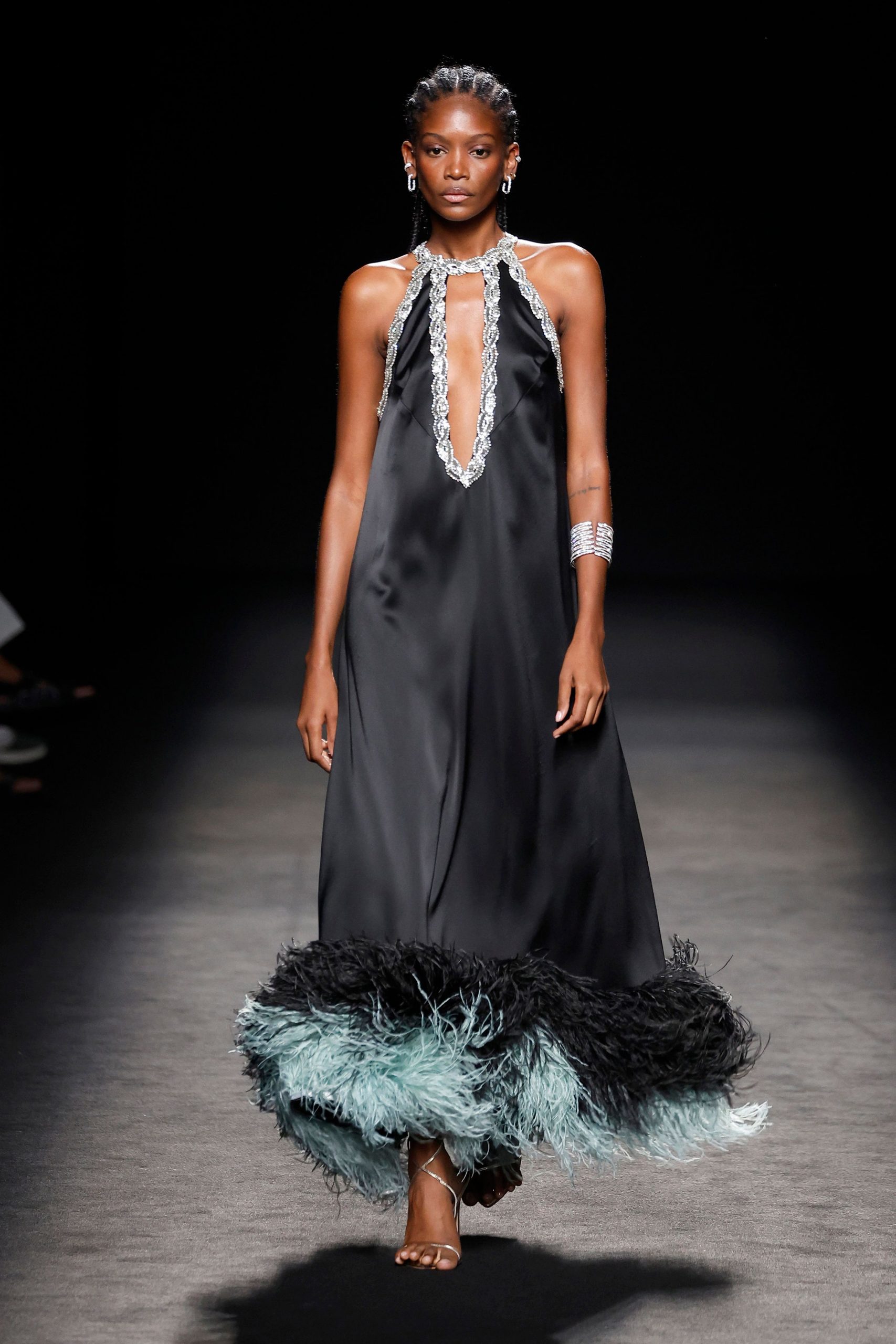 black silk sleeveless low-cut fitted ruffled layered gown