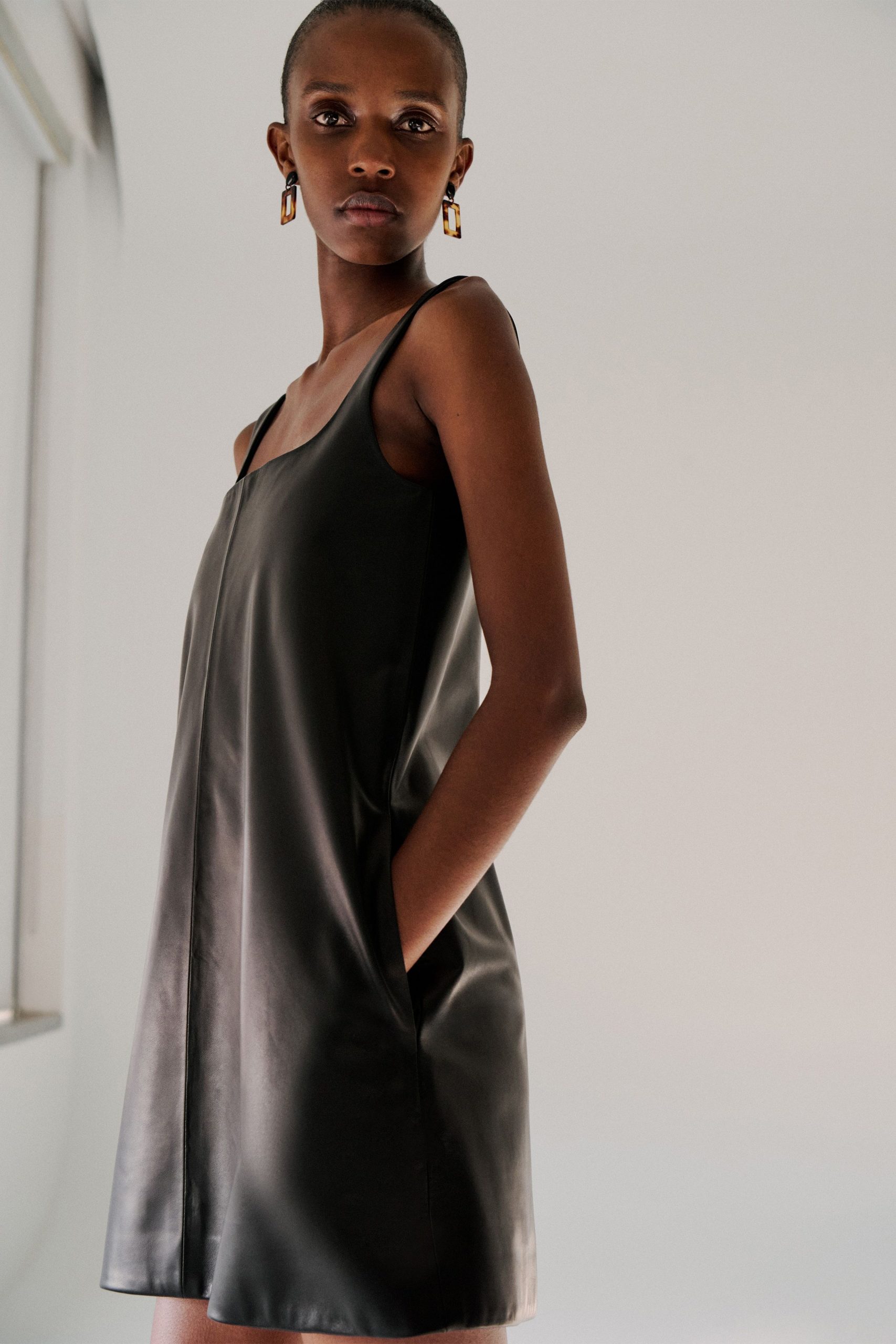black leather sleeveless mini dress