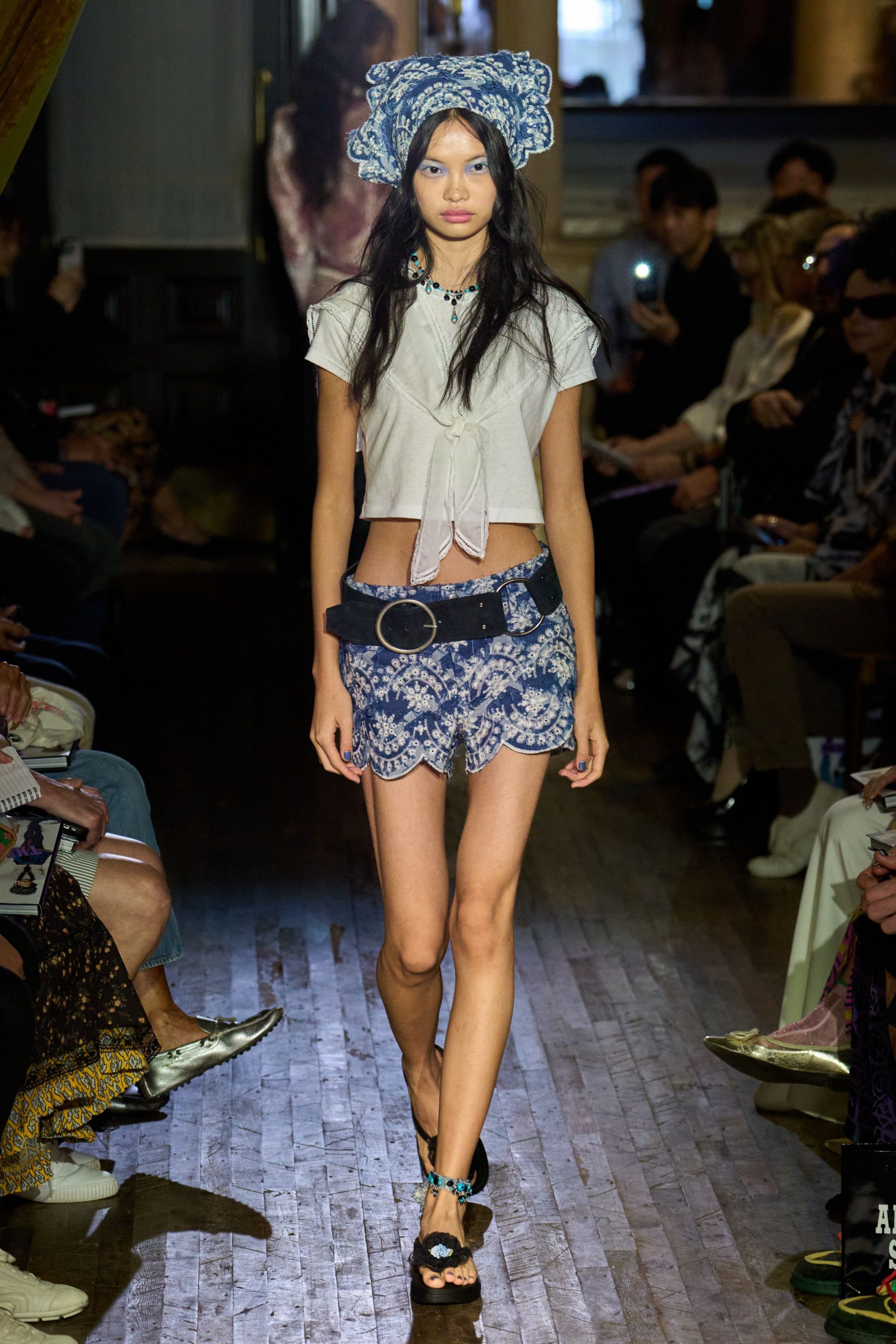 white fitted top with blue shorts
