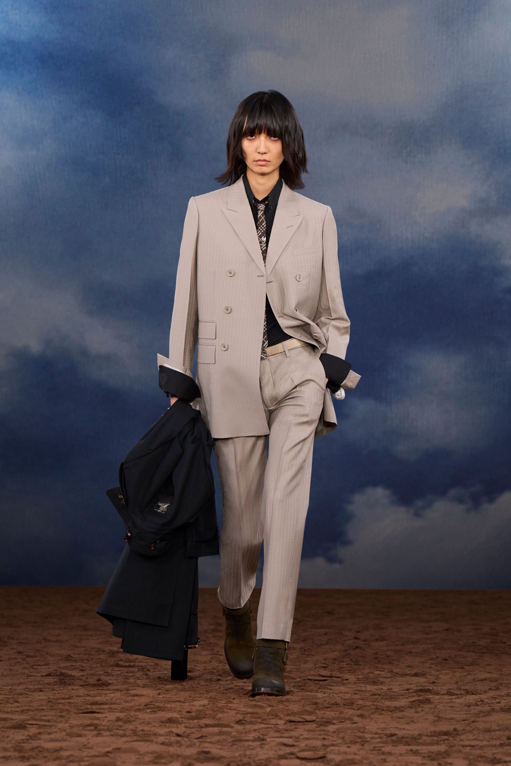 beige tailored suit with black jacket