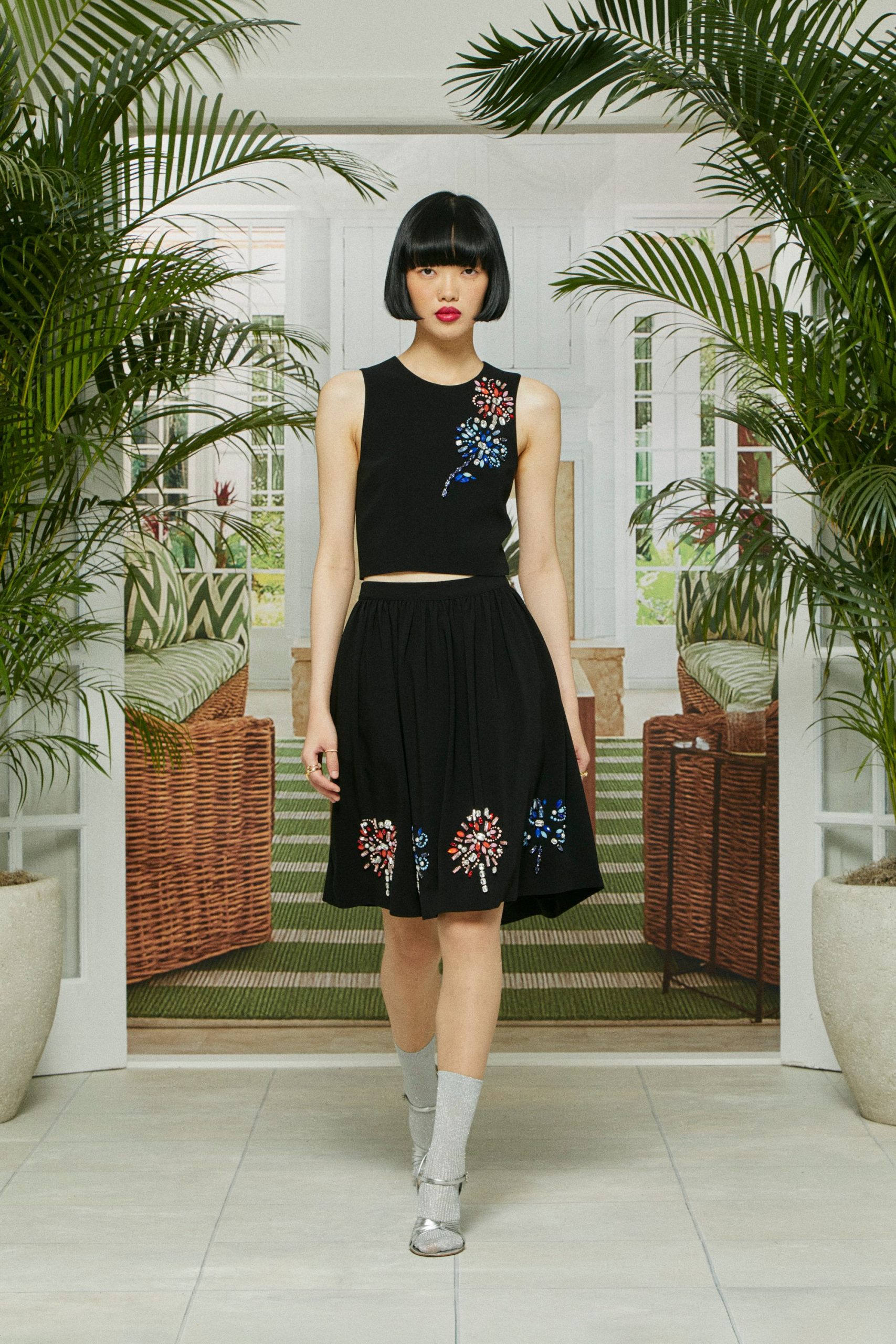 black embroidered crop top and skirt