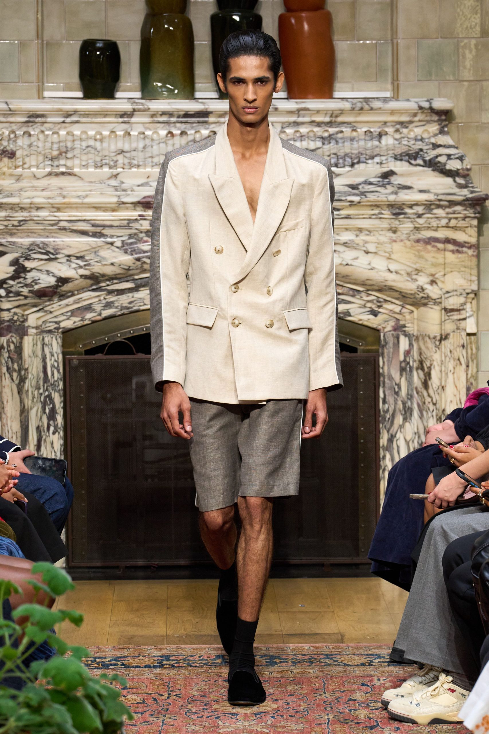 beige tailored blazer with gray shorts