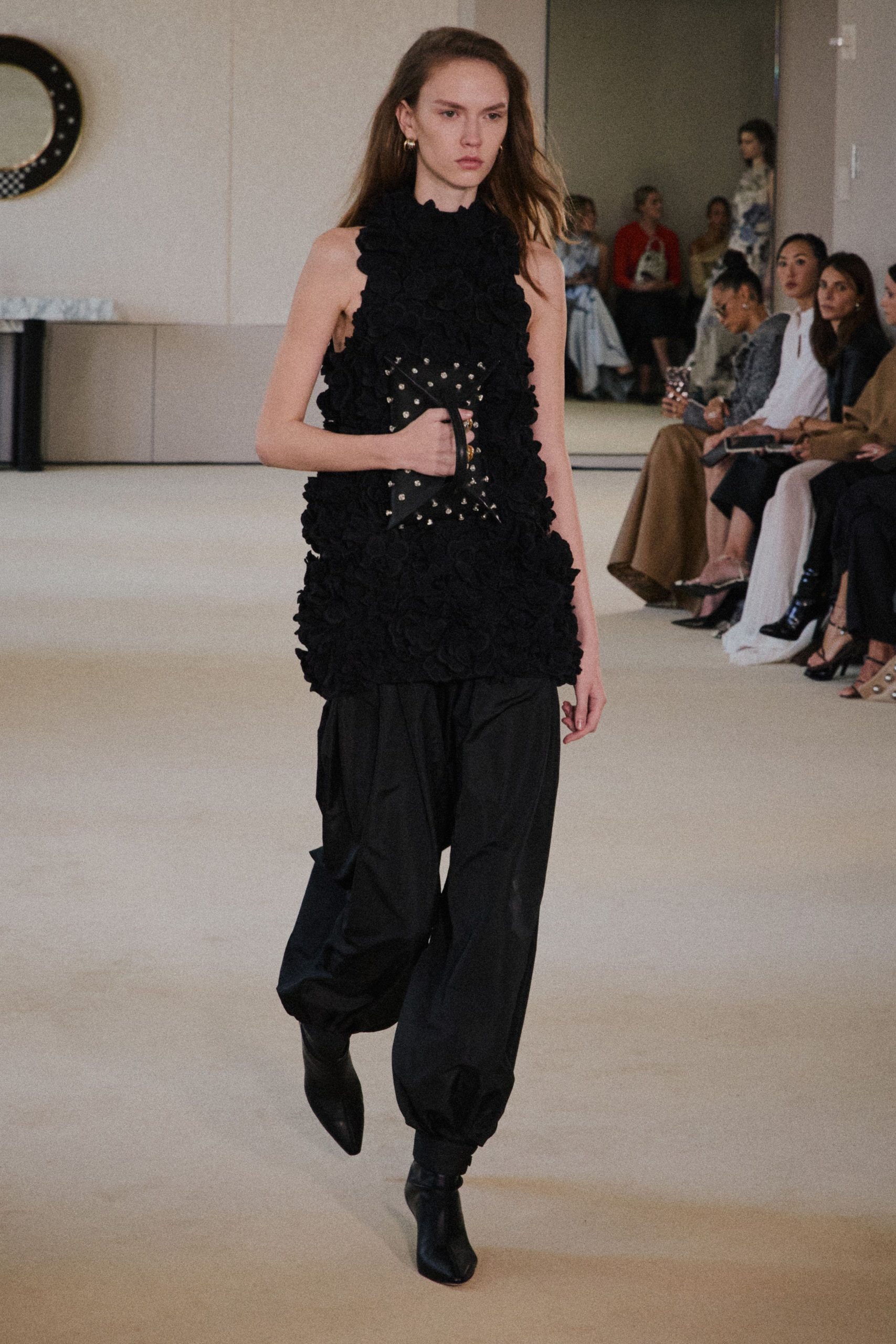 black embellished sleeveless top with relaxed pants
