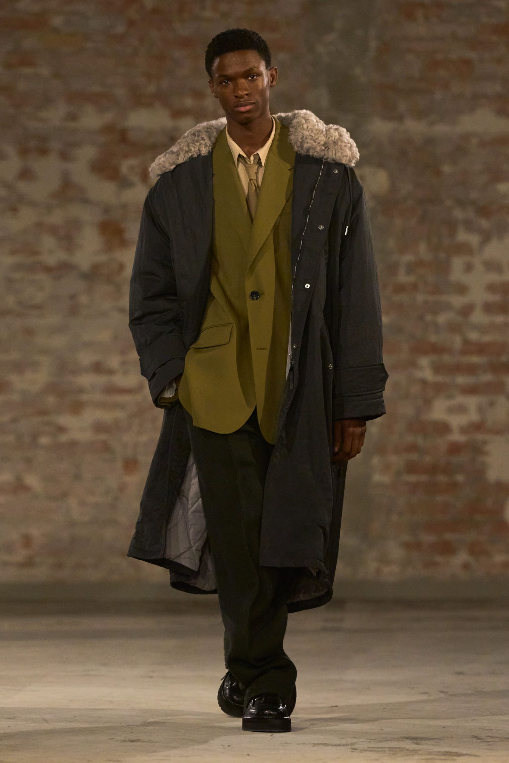 black coat green suit black pants