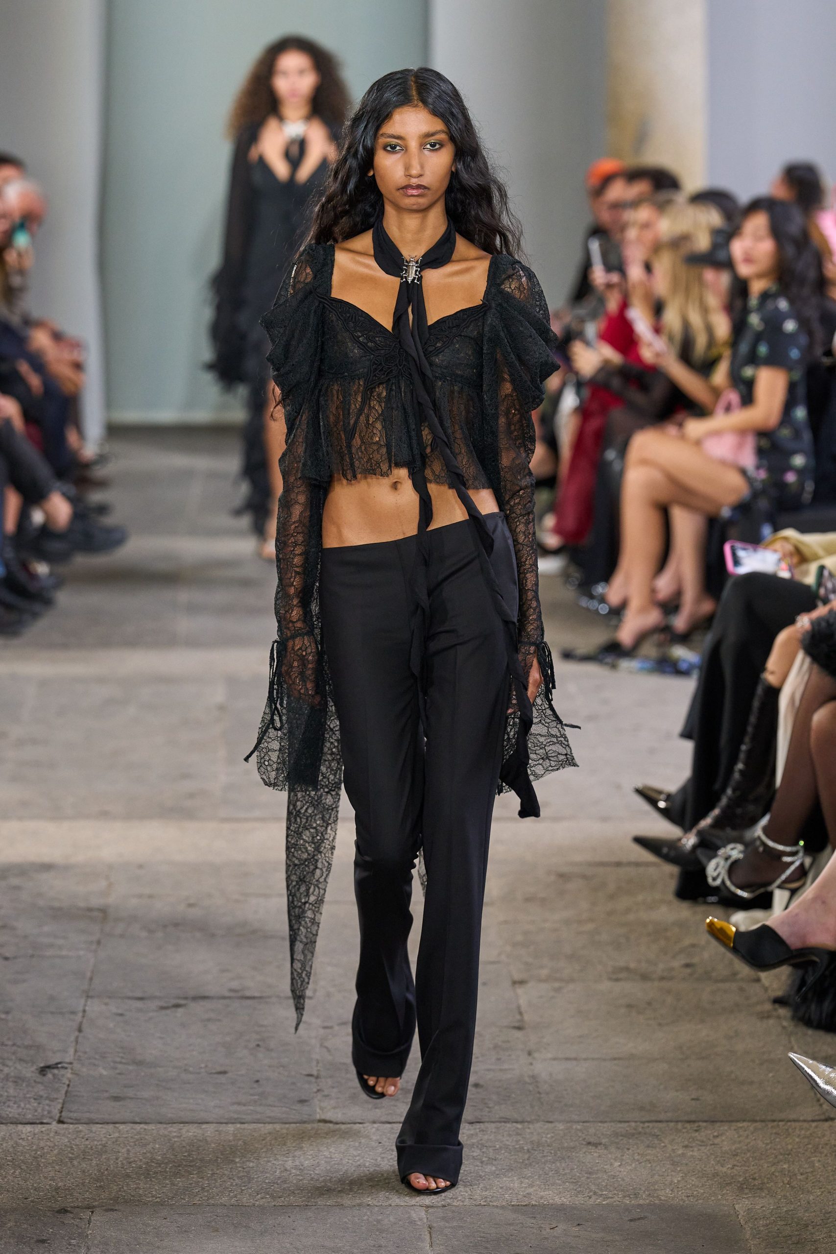 black lace top with slim pants