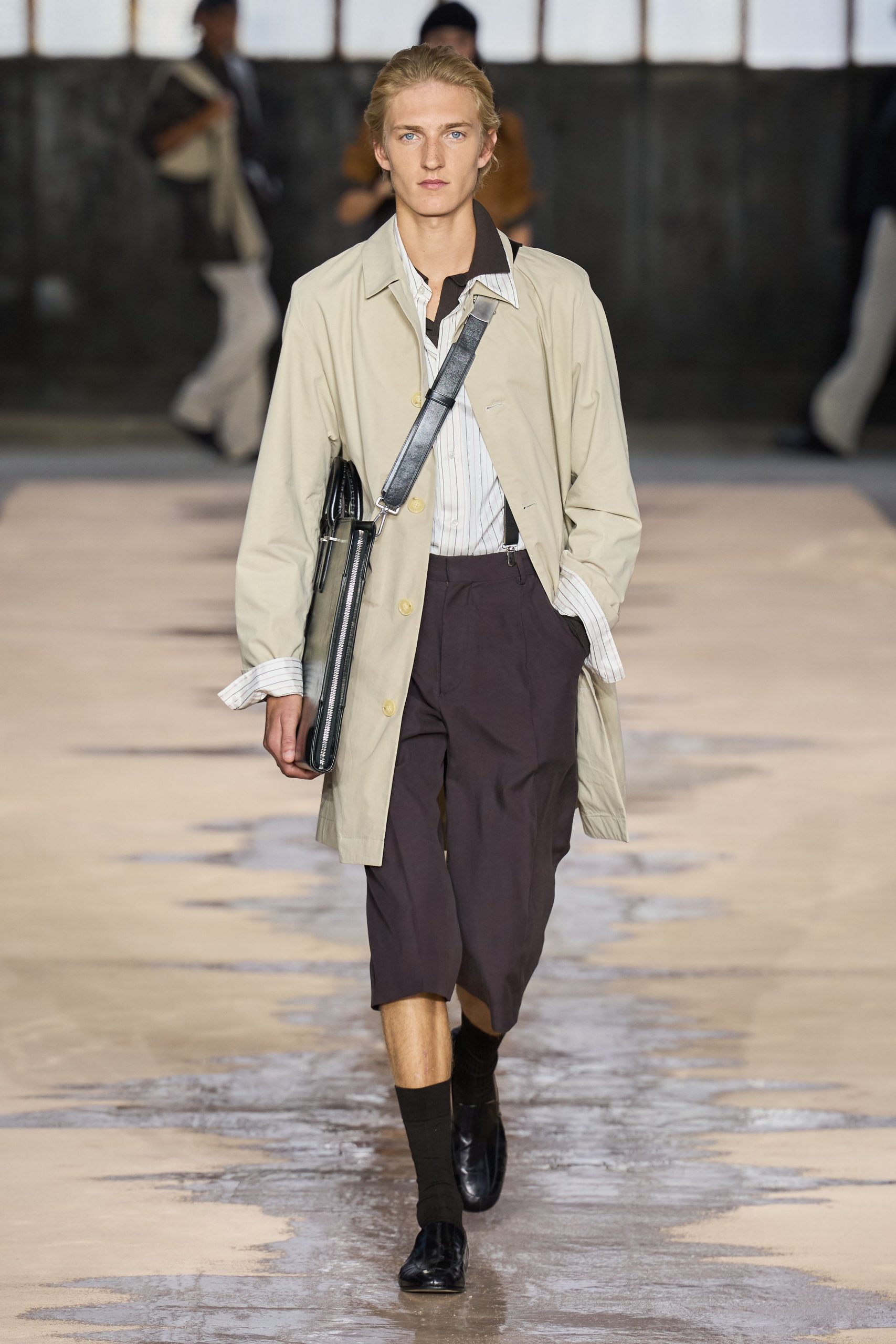 beige trench coat with black shorts