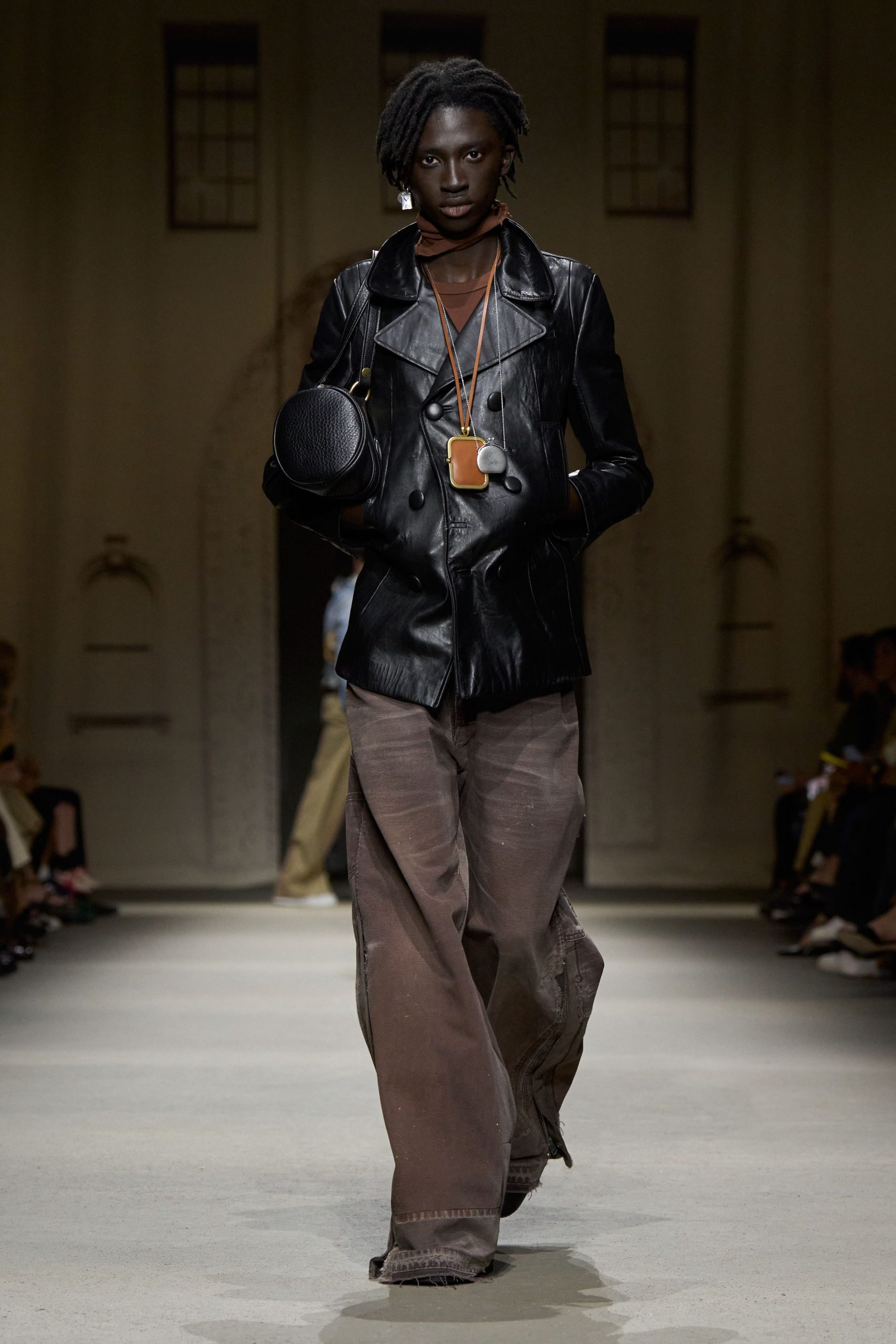 black leather fitted jacket with baggy pants