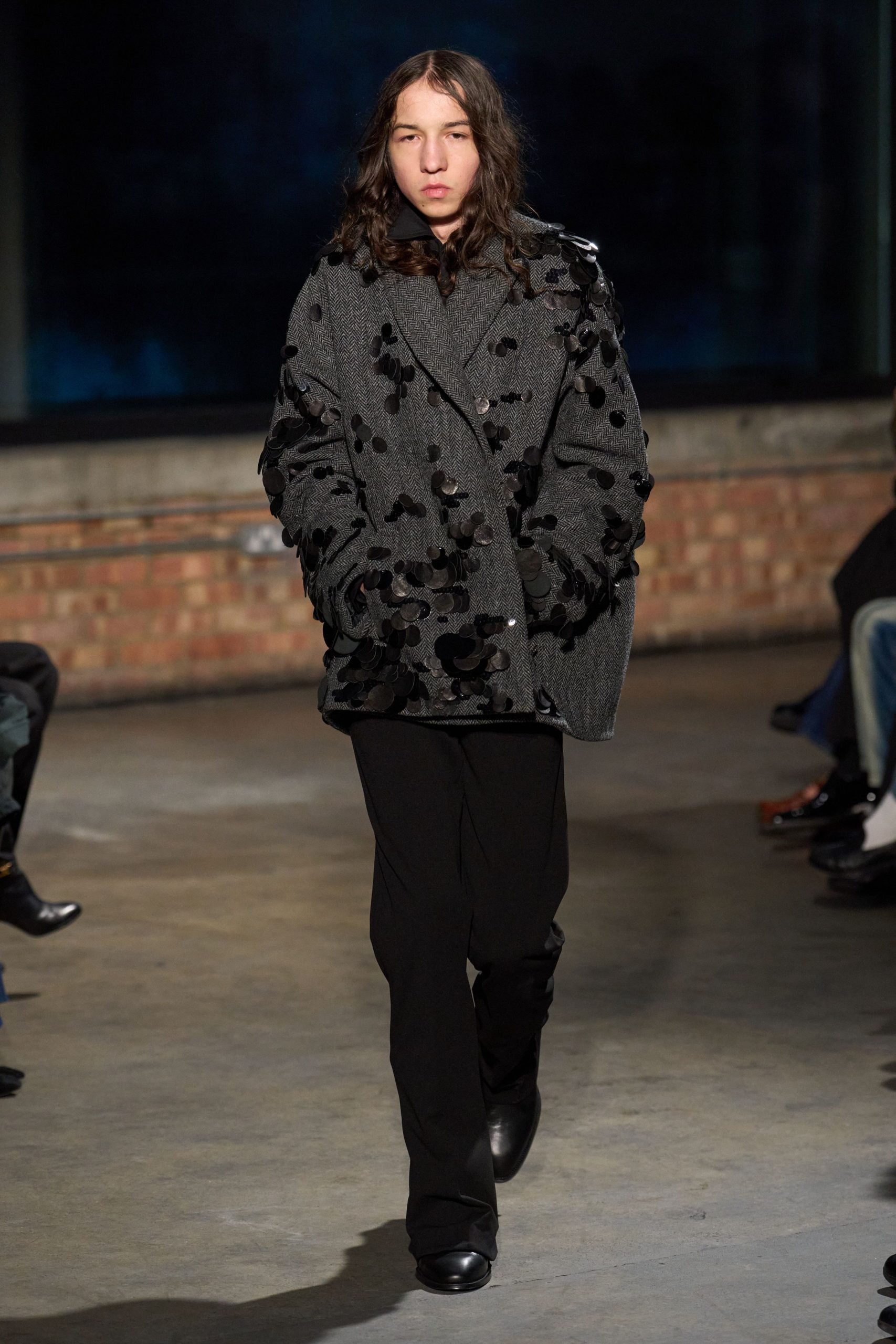 gray embroidered coat with black pants