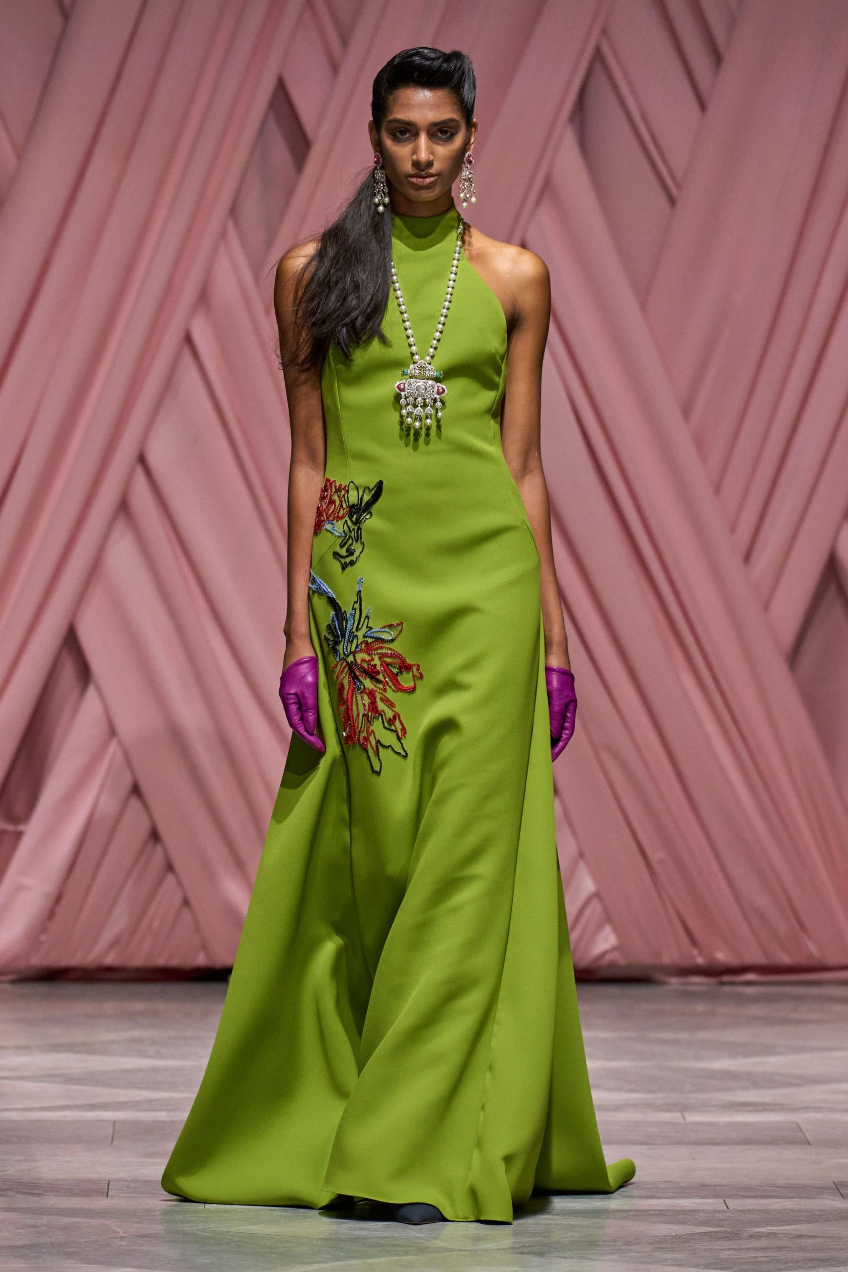 green silk sleeveless high-neck fitted embroidered flowing gown