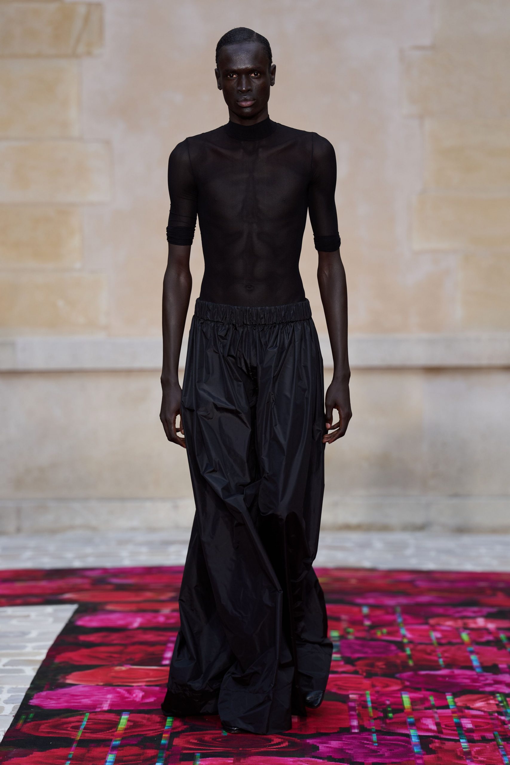 black mesh top and relaxed pants