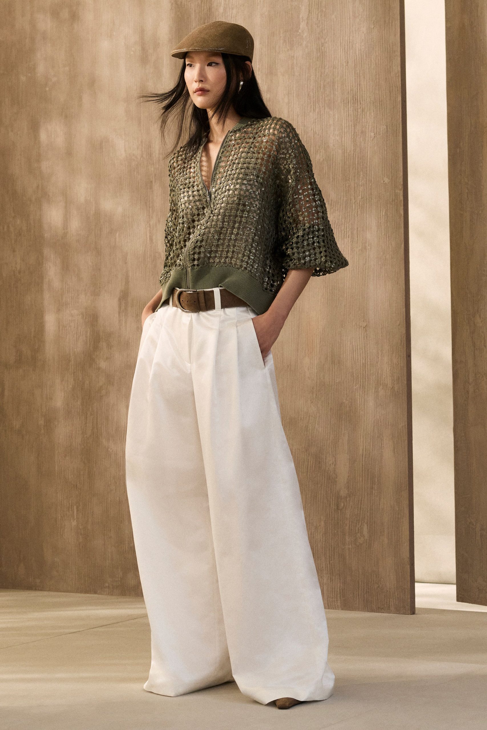 green crochet top with white pants