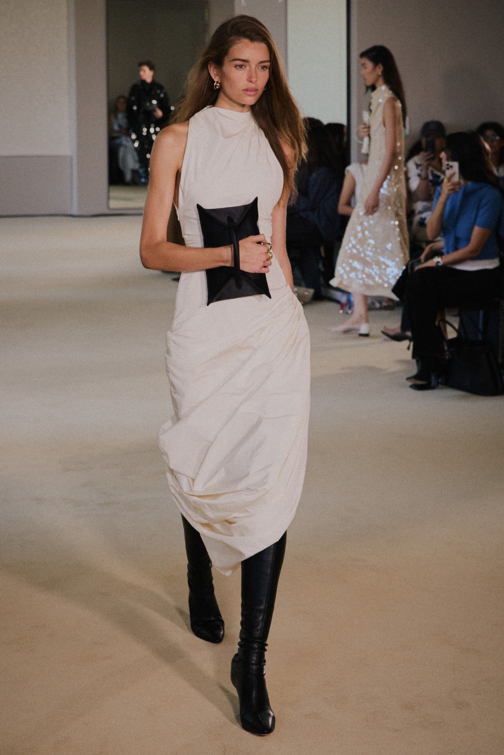 white fitted midi dress with black boots