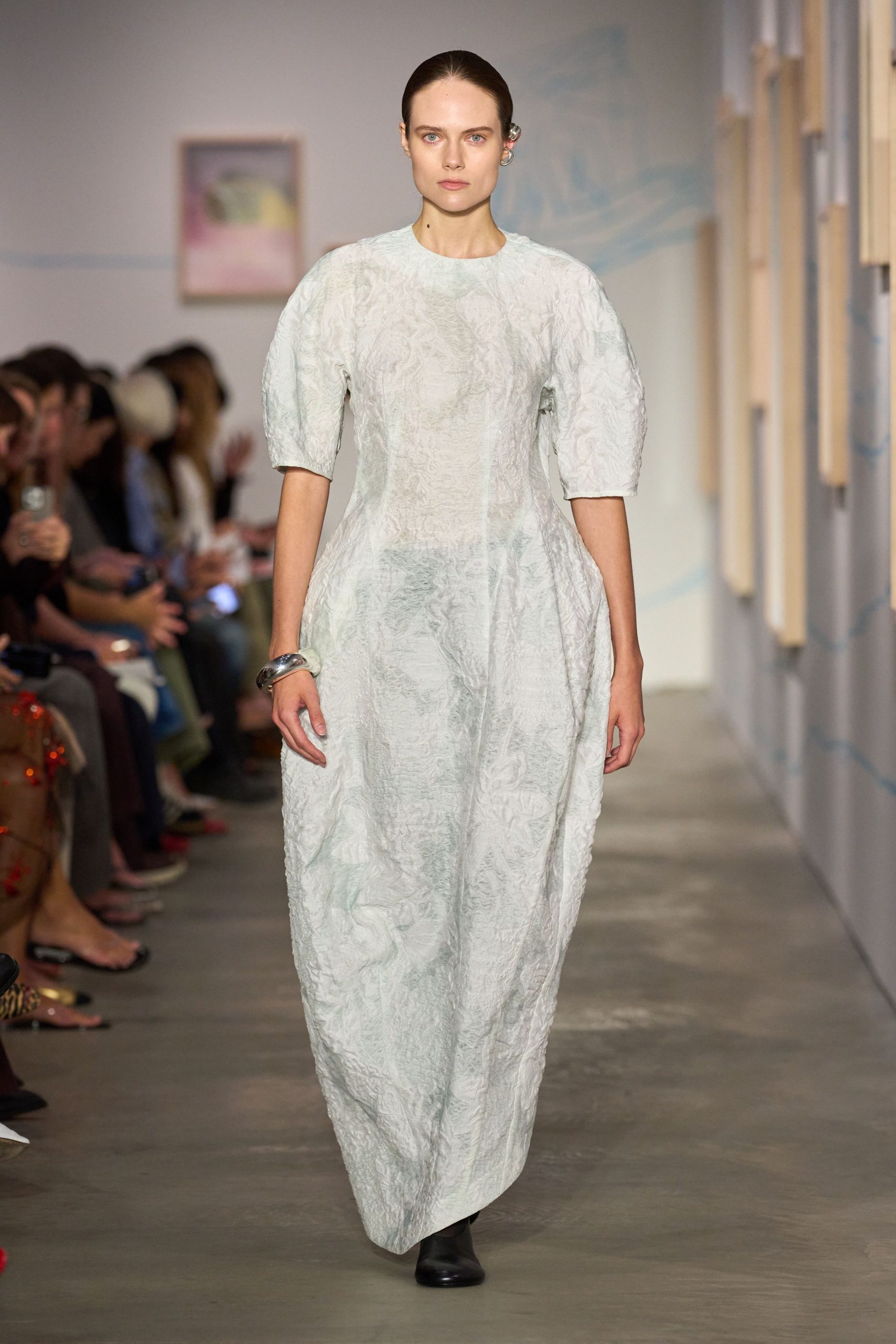 white silk pleated gown with black boots