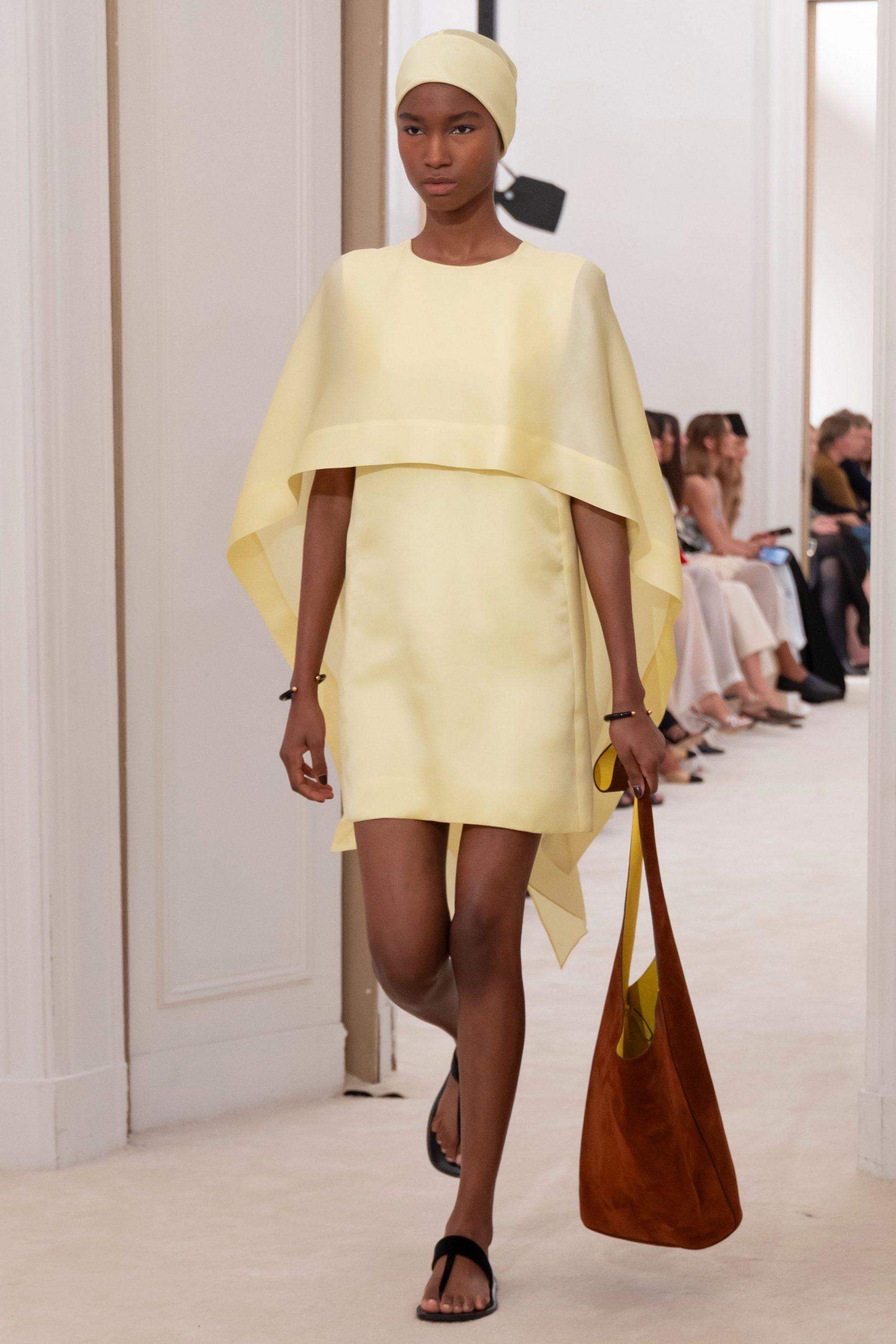 yellow mini dress with layered cape