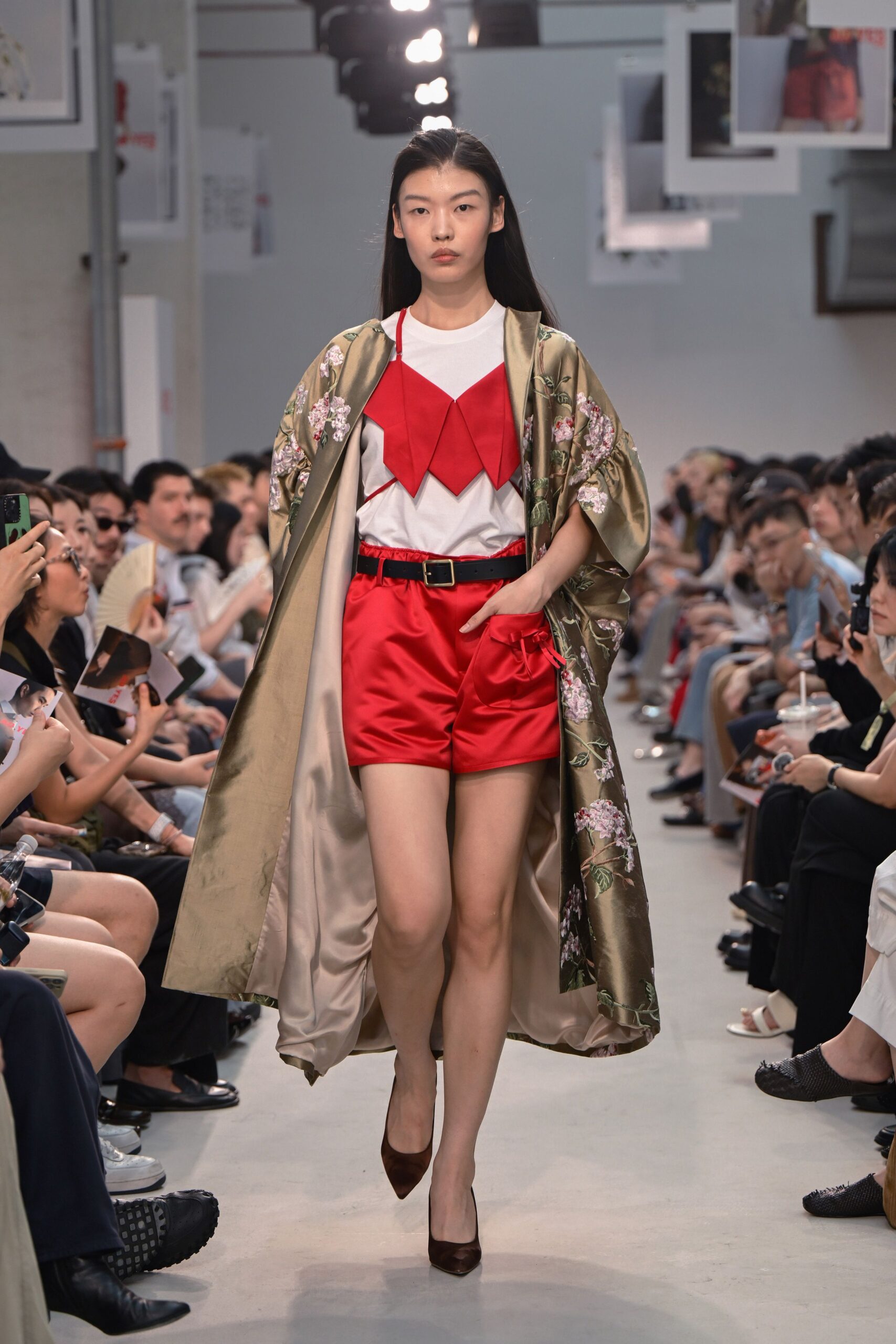 green floral coat with red shorts