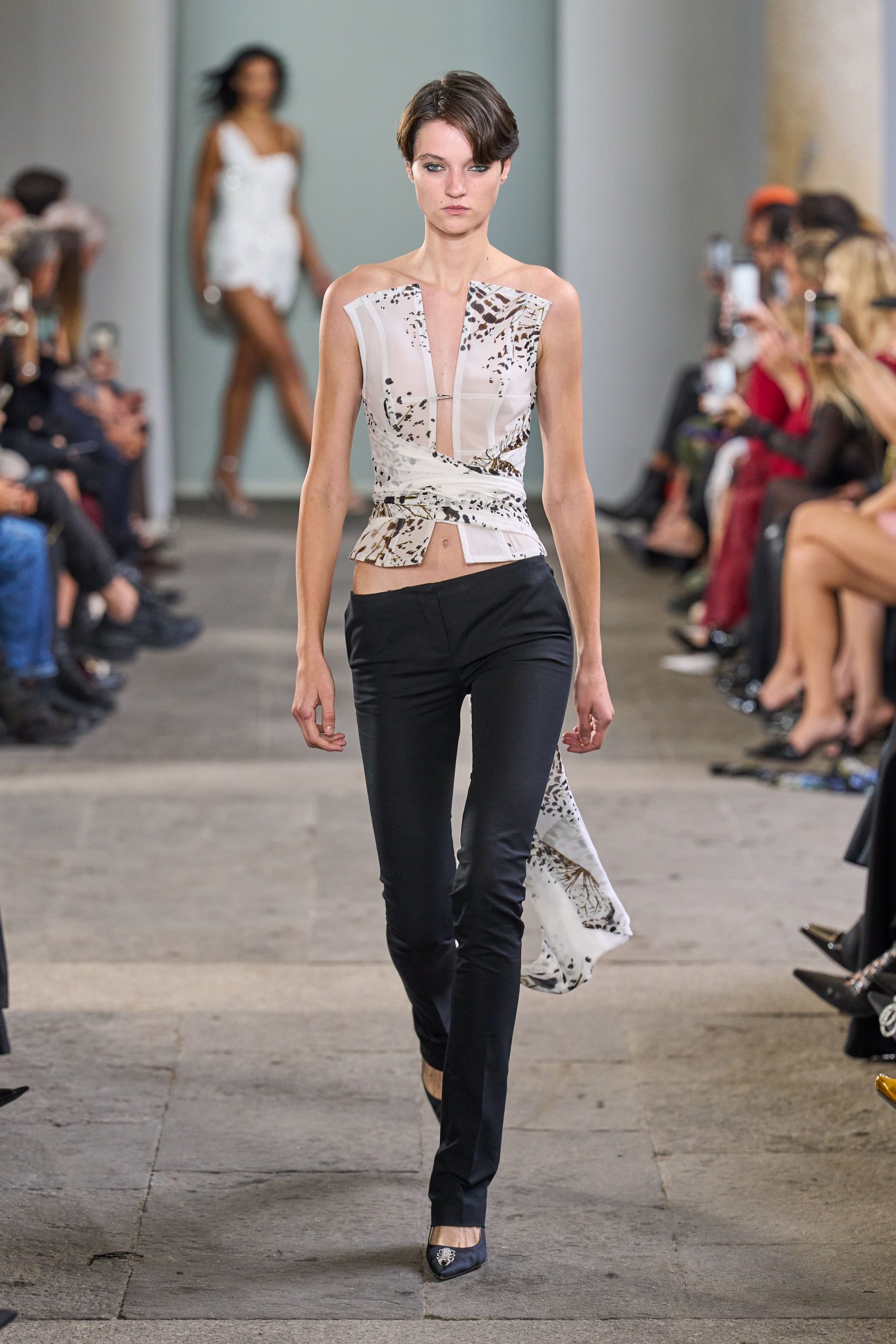 fitted white silk top with black pants