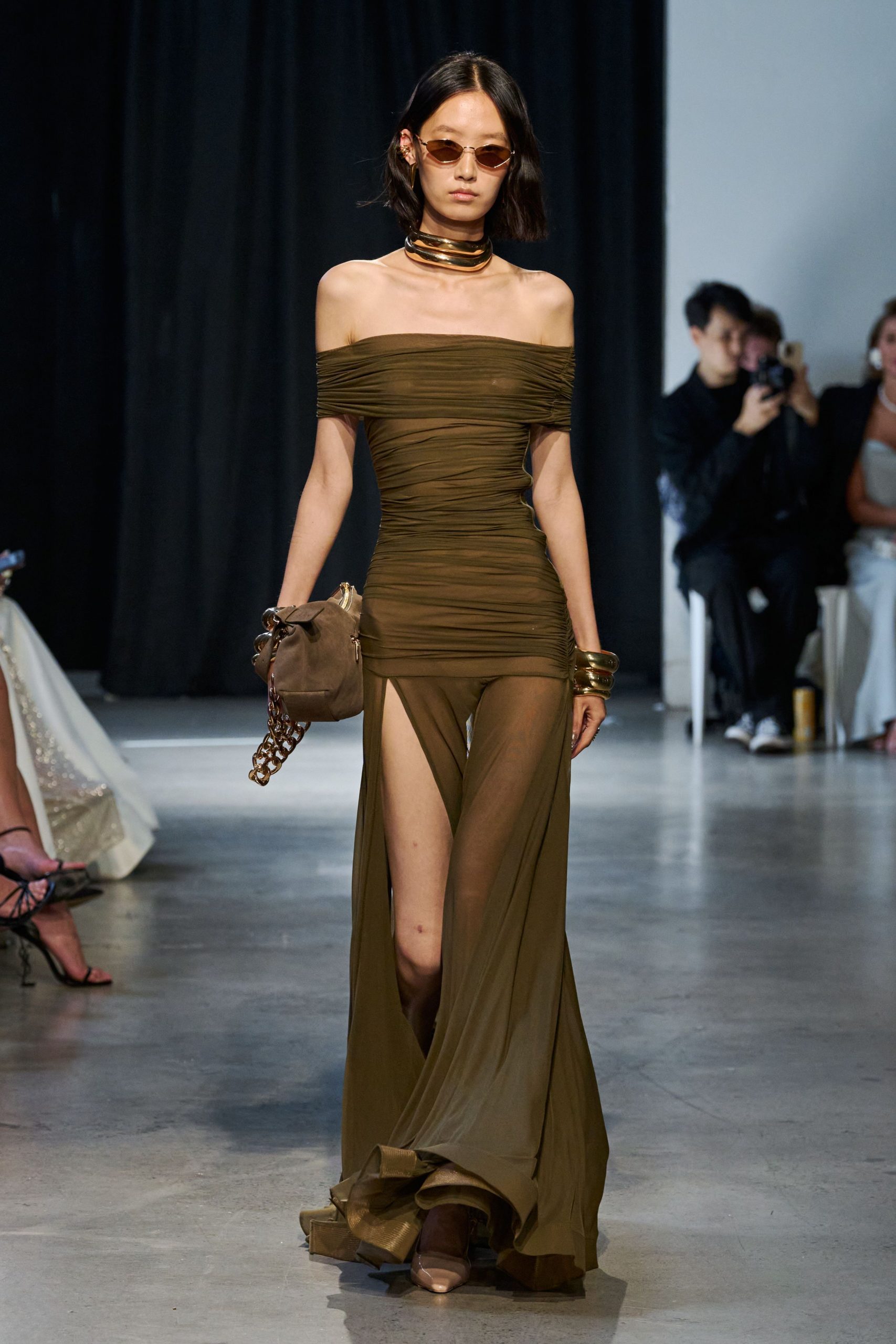 green silk off-shoulder high-neck fitted ruched sheer gown