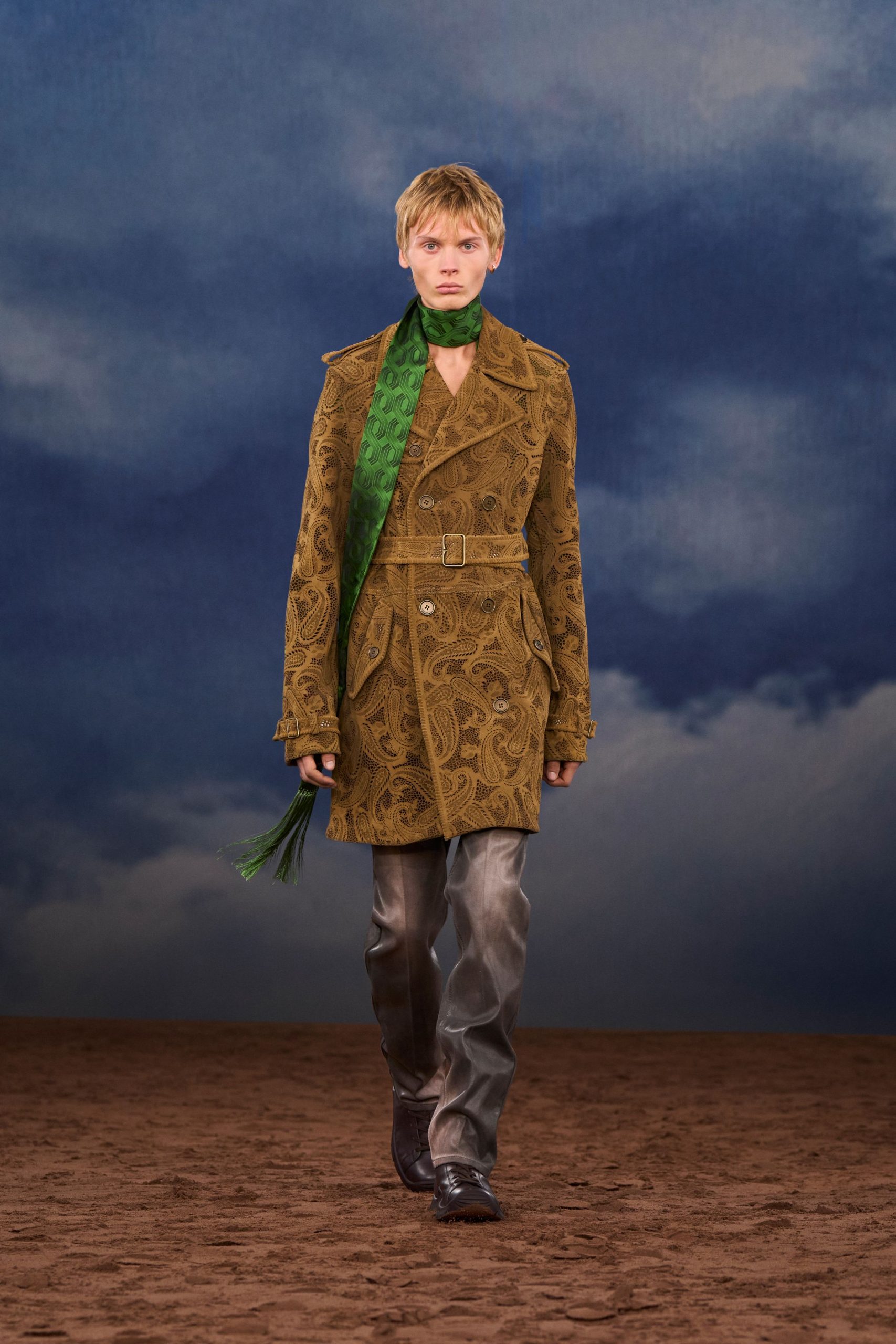 brown embroidered coat with green scarf