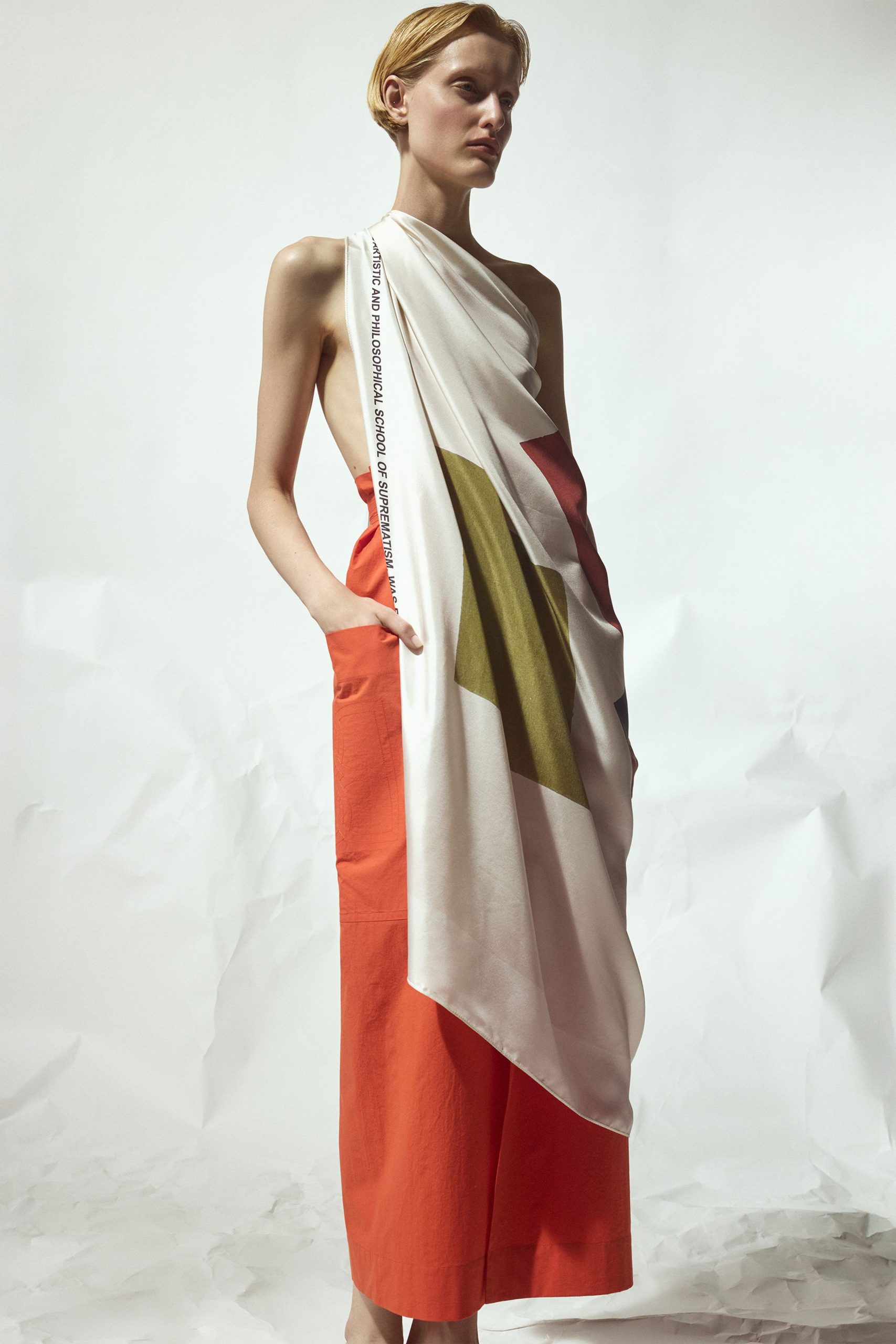 orange and white draped dress