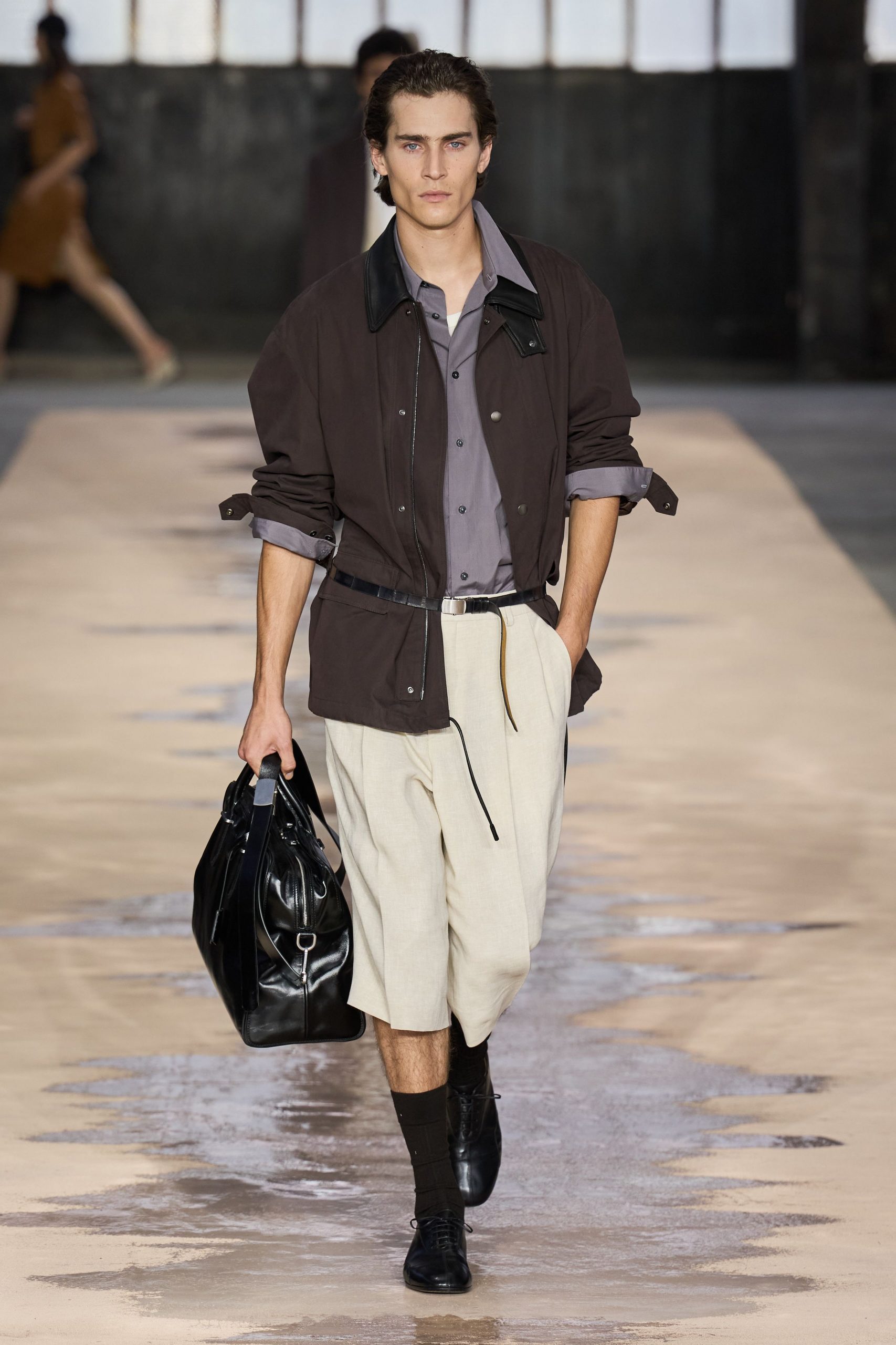brown jacket gray shirt beige shorts