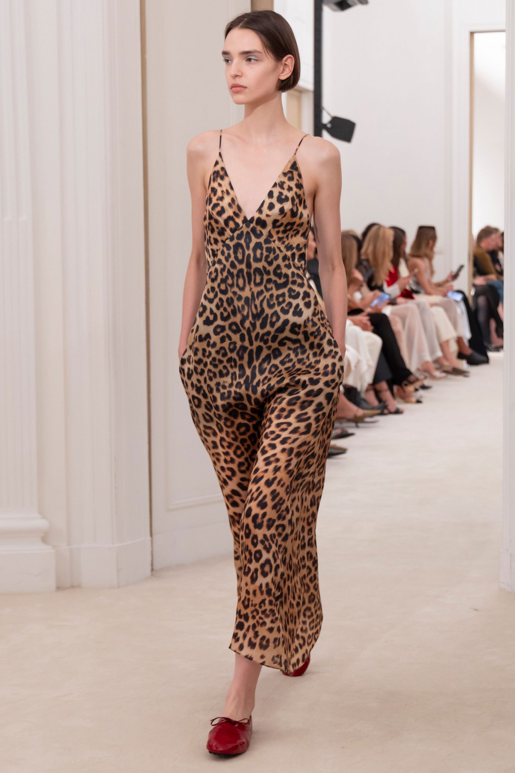 brown animal-print jumpsuit with red shoes