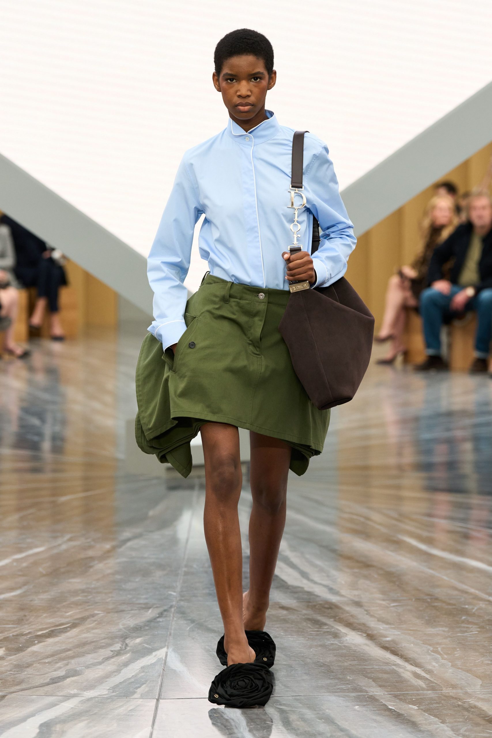 blue shirt green skirt black shoes