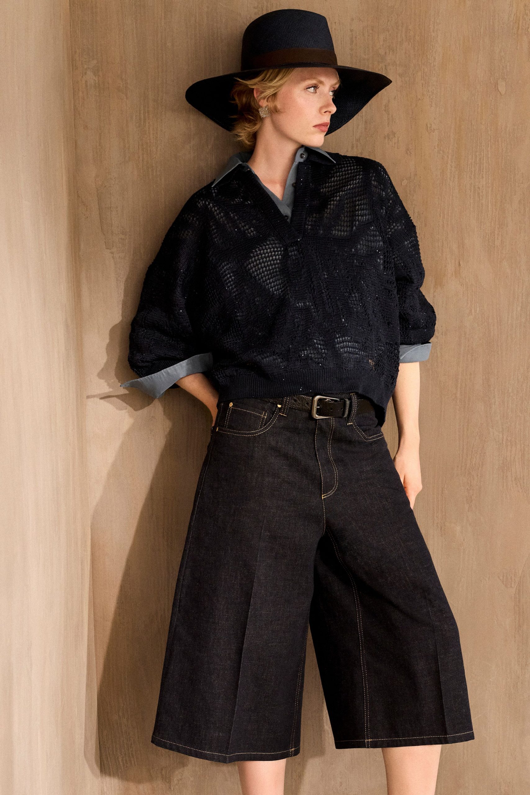 black shirt blue wide-leg pants