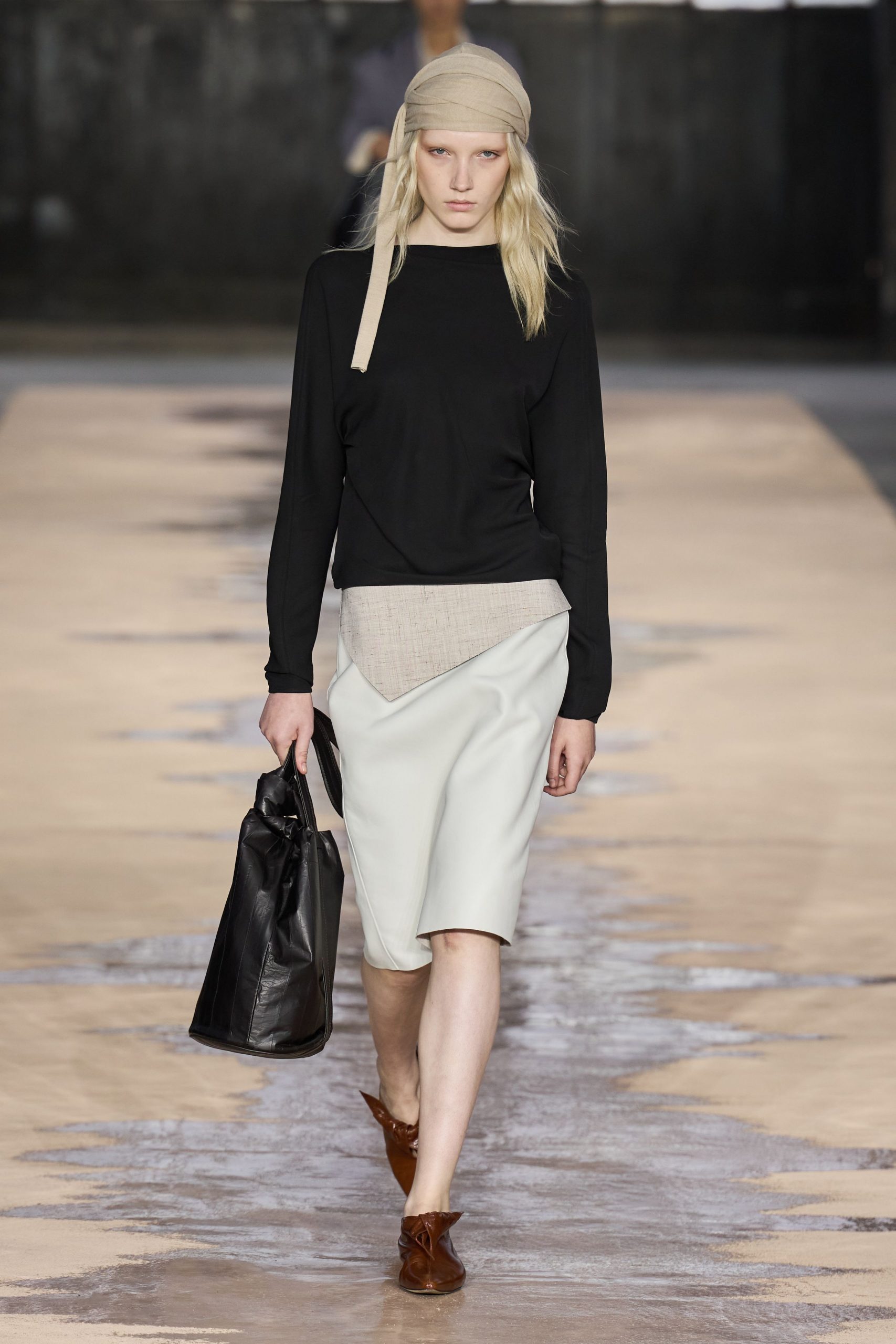black fitted top with asymmetric skirt