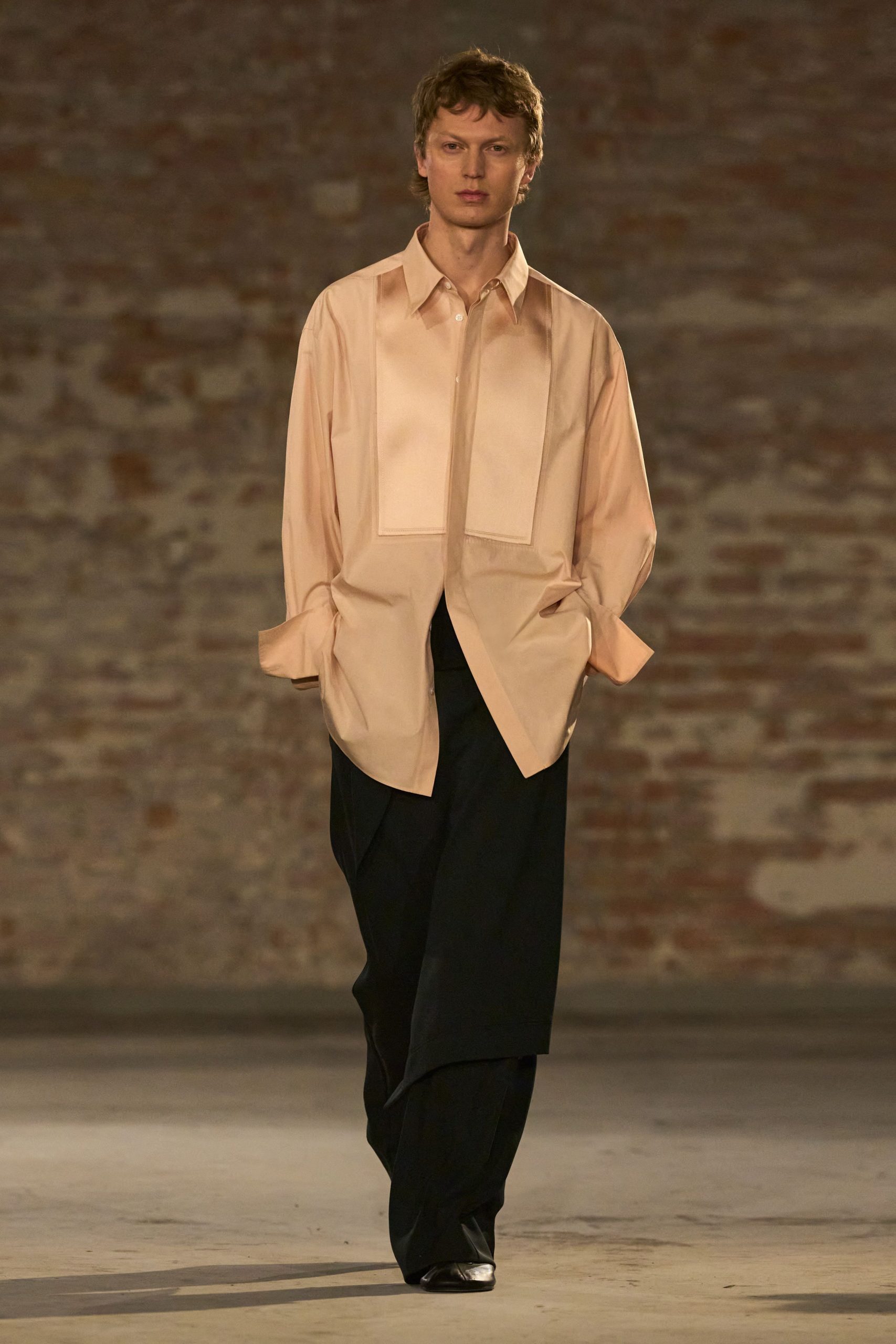 pink silk relaxed shirt with black tailored pants