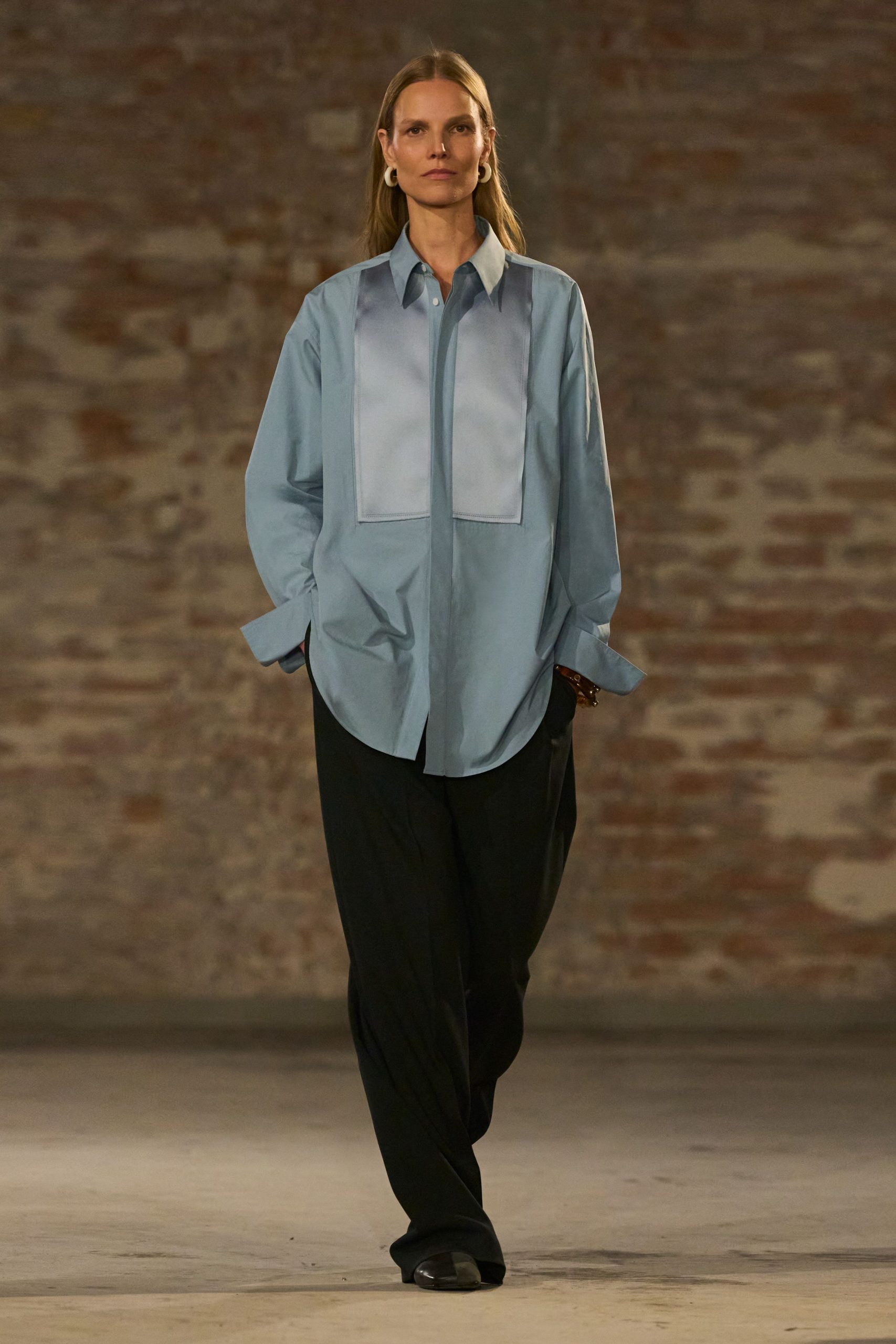 blue relaxed shirt with black pants