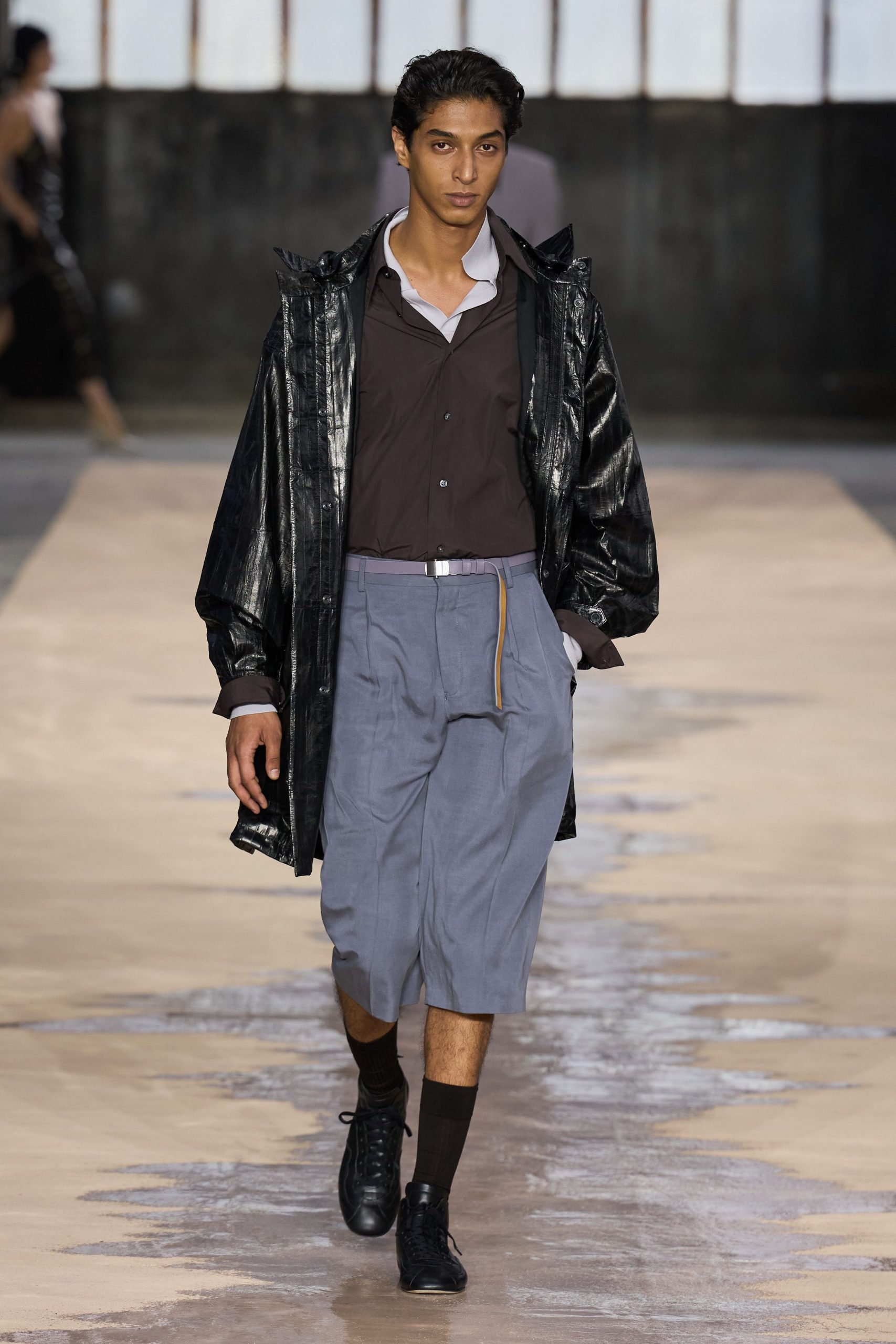 black vinyl coat with gray pants