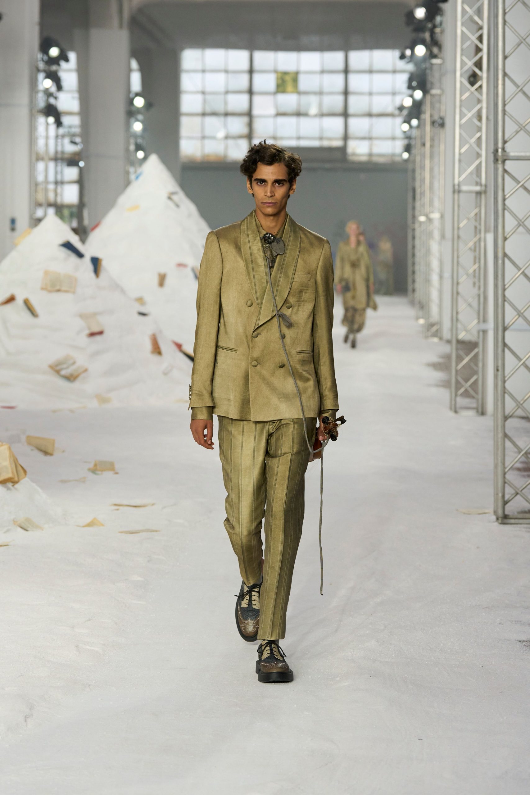 beige tailored suit with black shoes