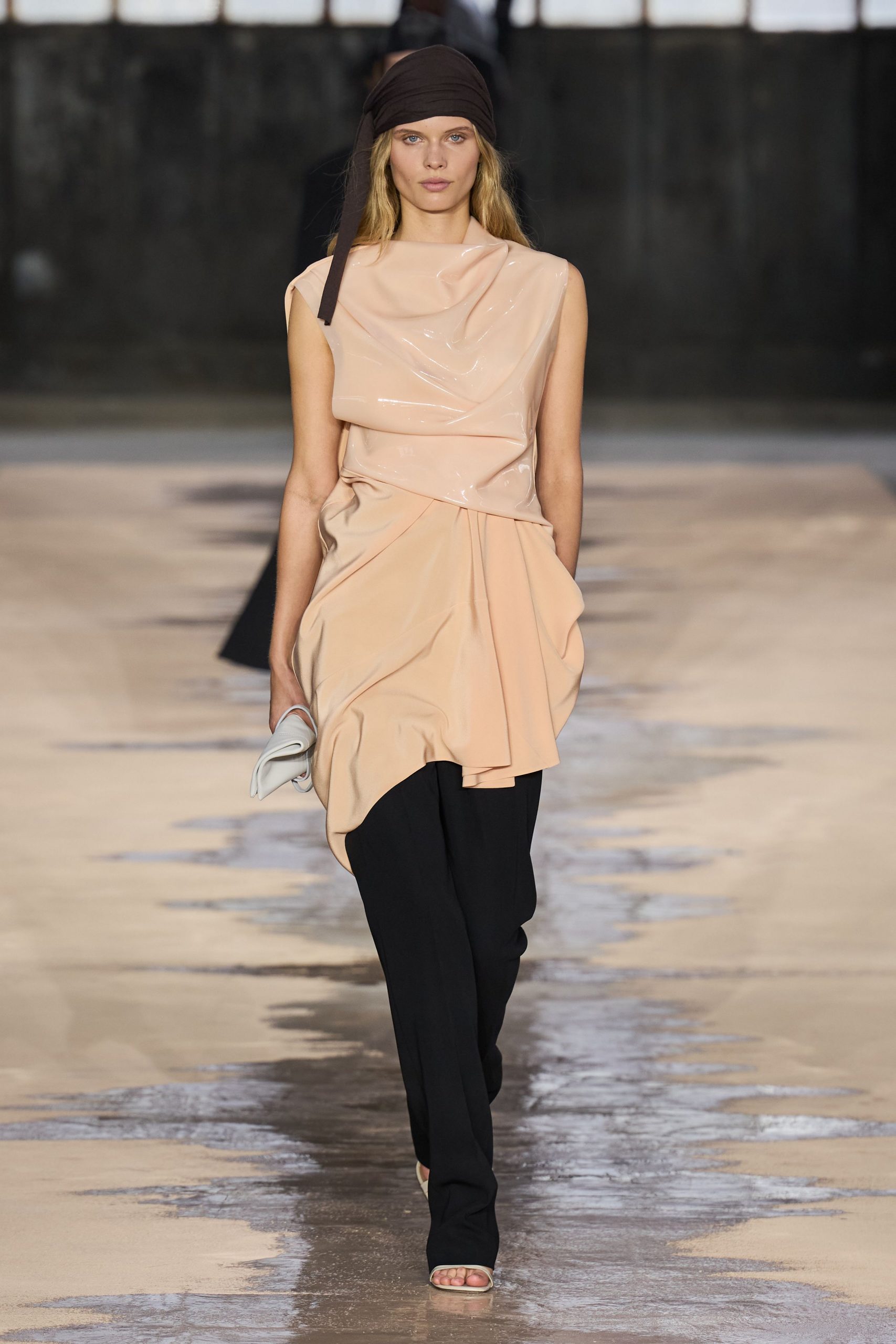 peach silk sleeveless top with black pants