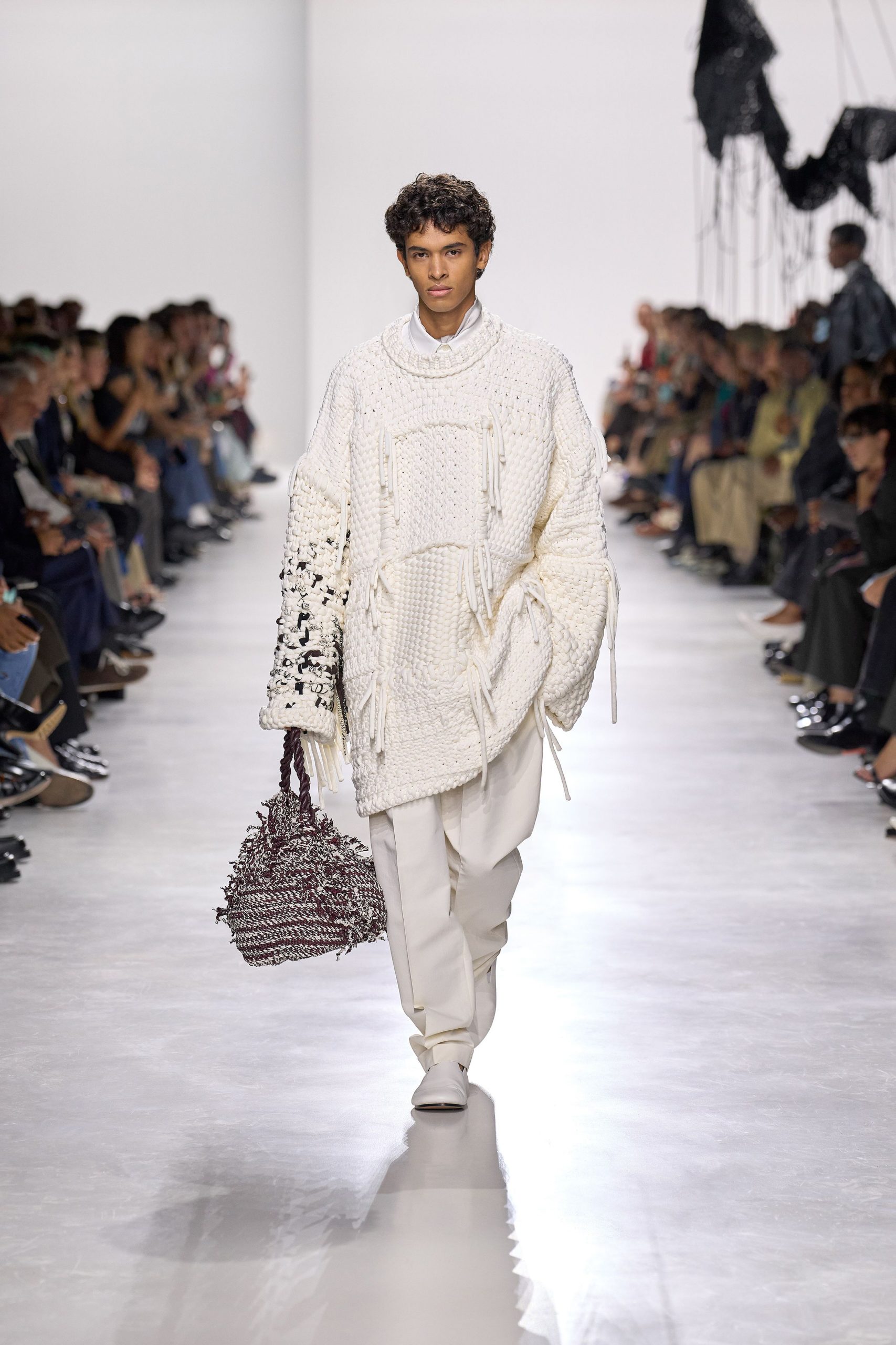 white oversized sweater with beige pants