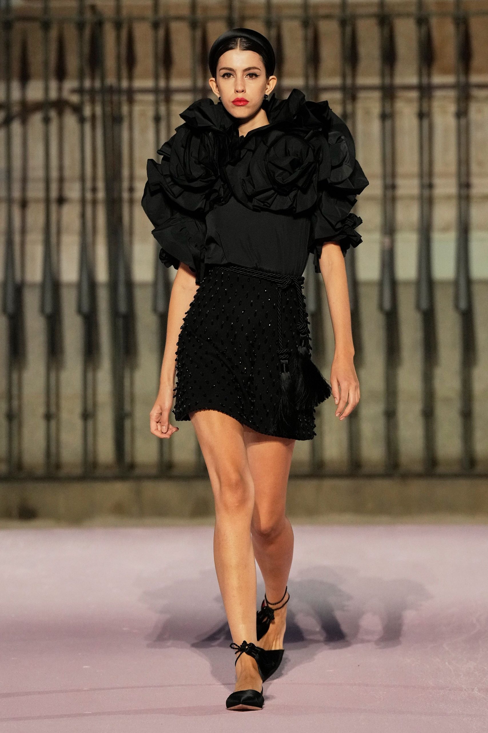black ruffled top and mini skirt