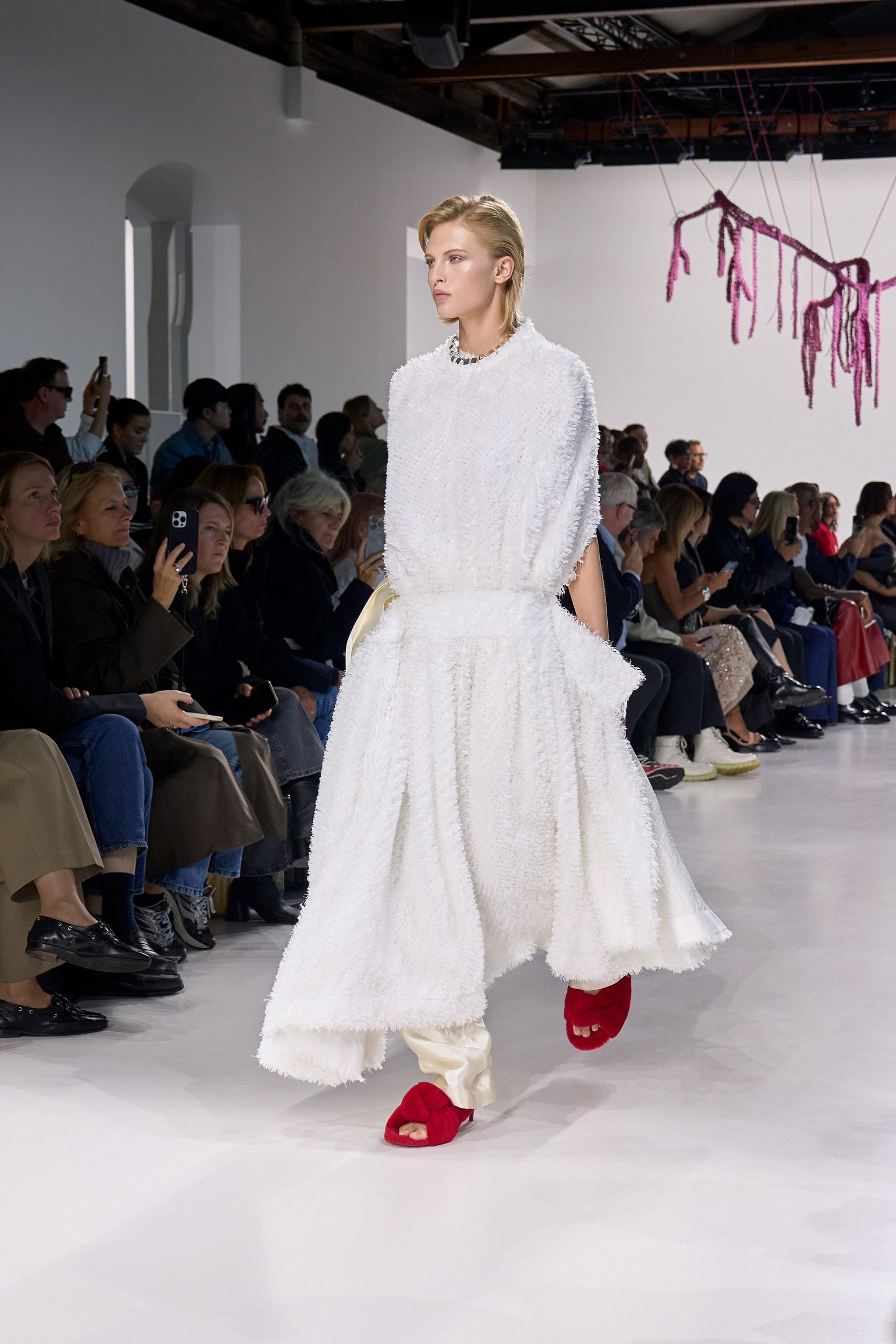 white relaxed sleeveless dress with red shoes