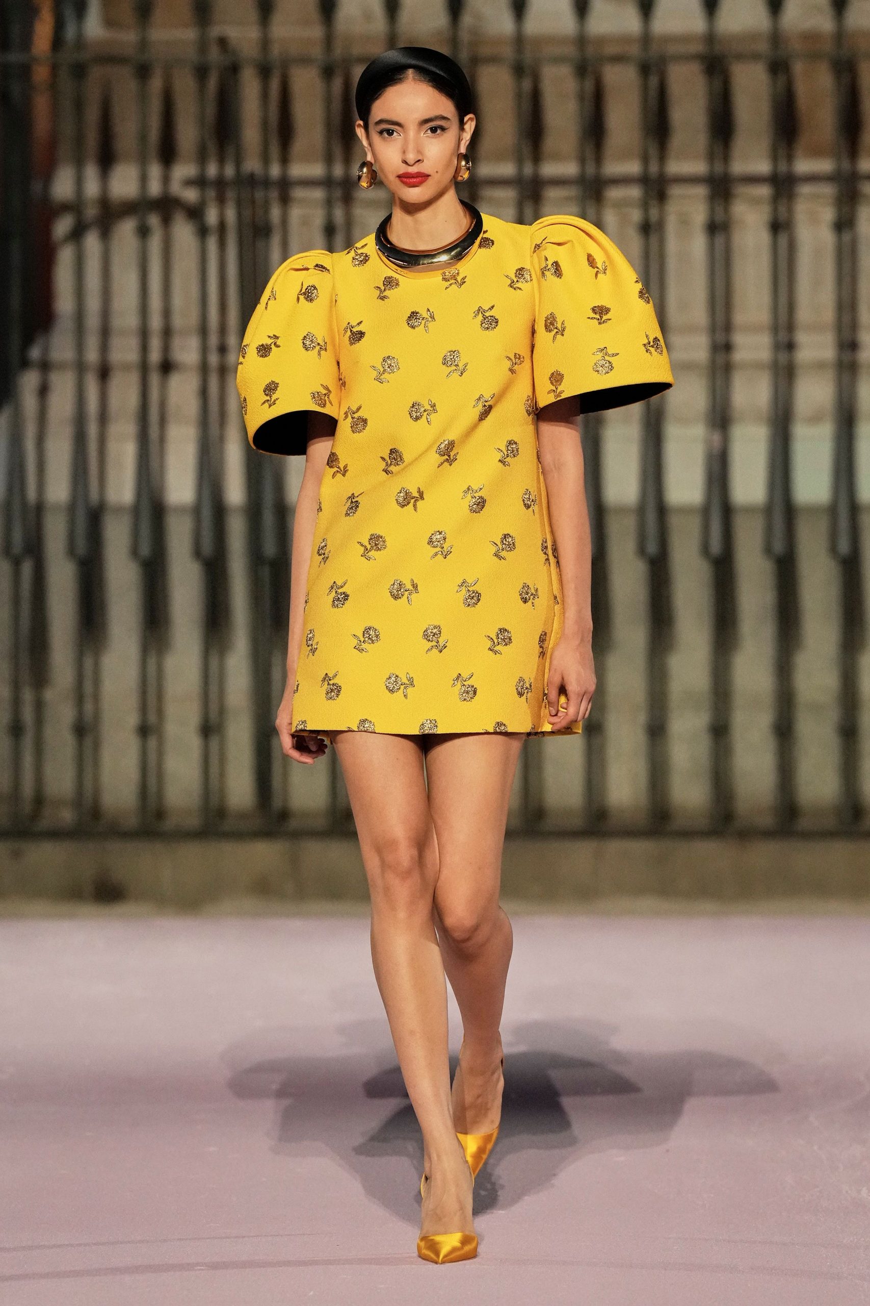 yellow embroidered mini-dress with orange shoes
