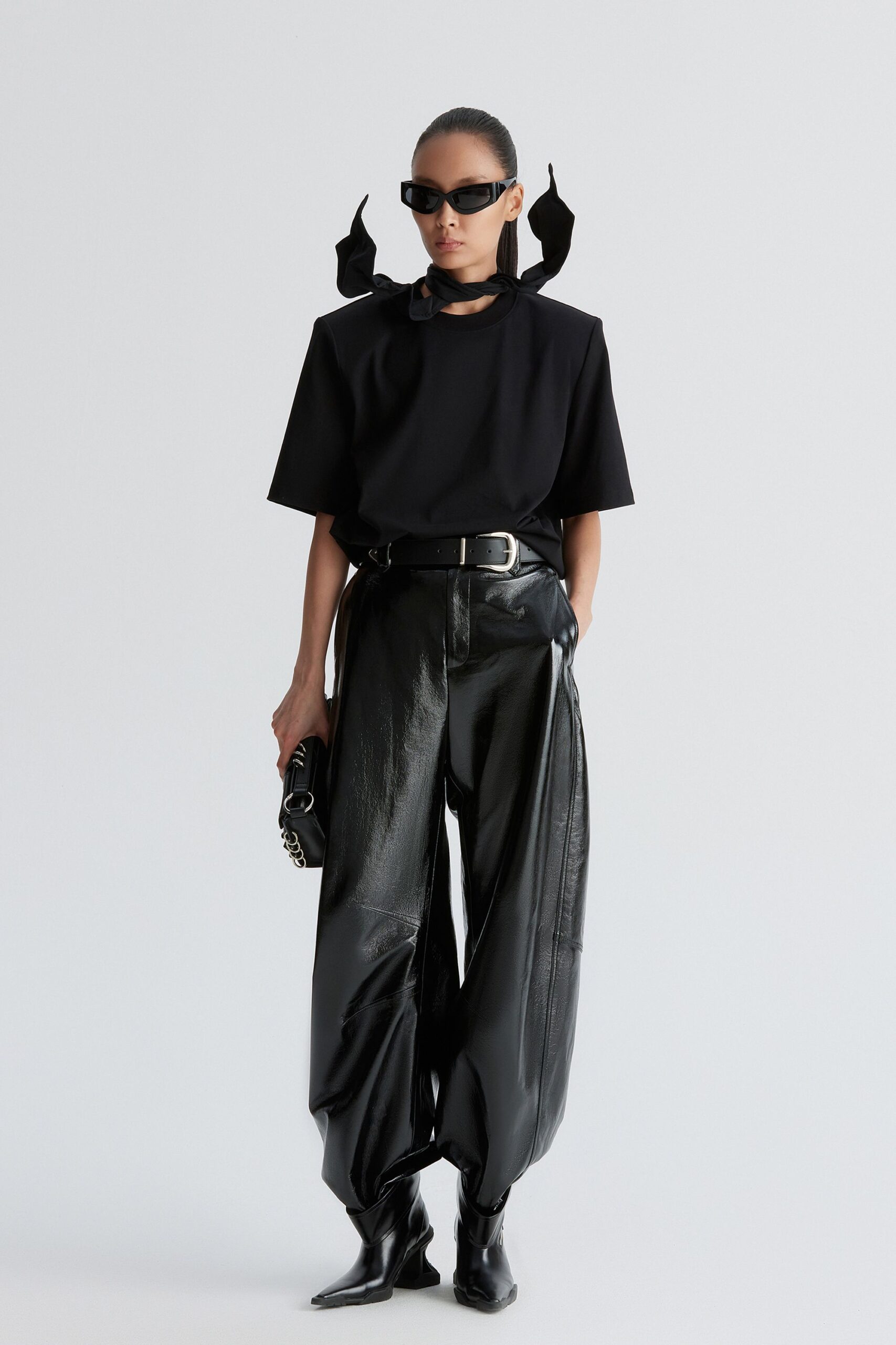 black relaxed top and leather pants