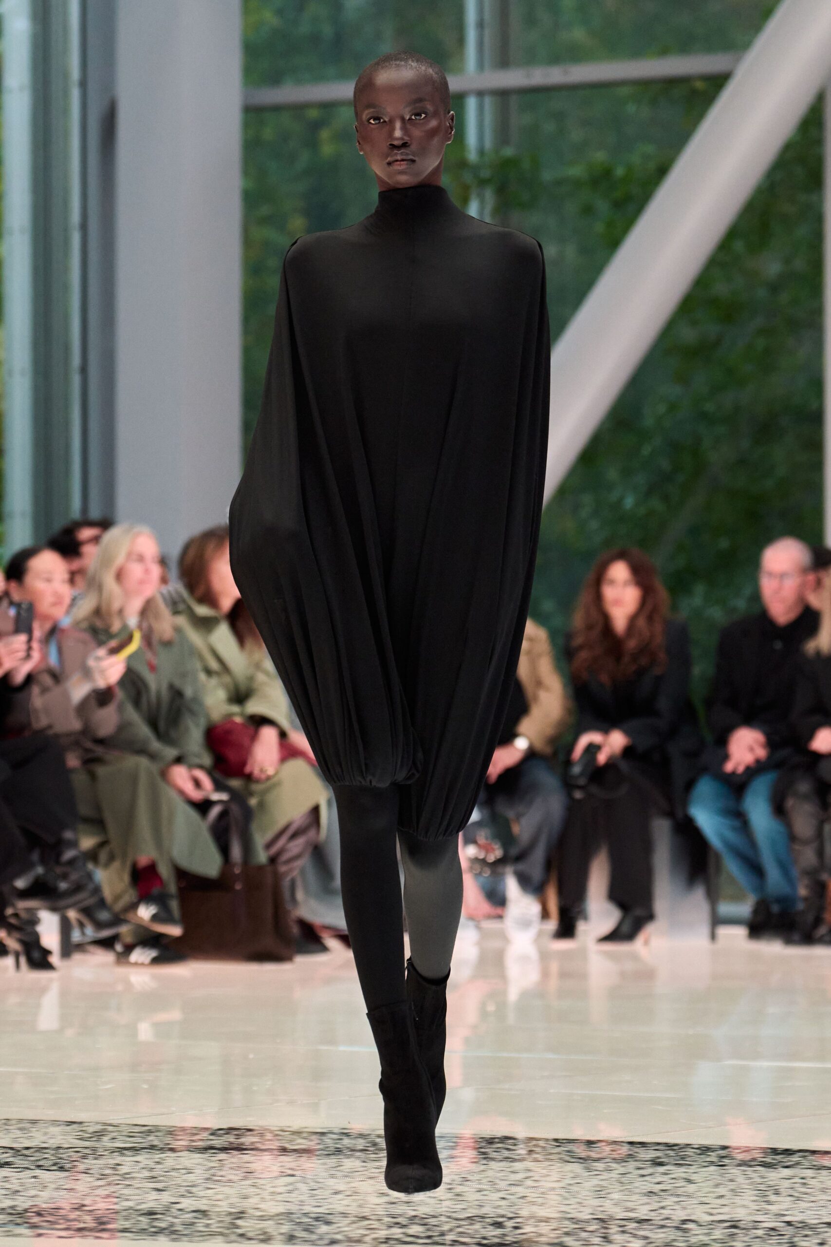 black relaxed long-sleeve dress with boots