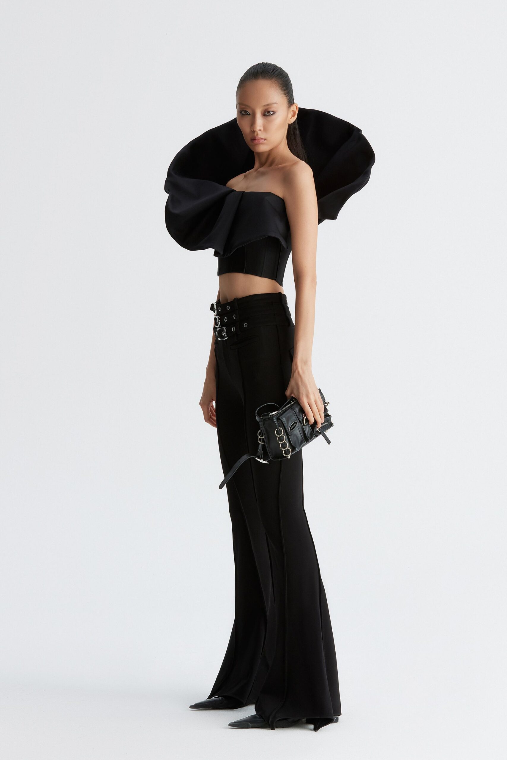 black ruffled top with flared pants