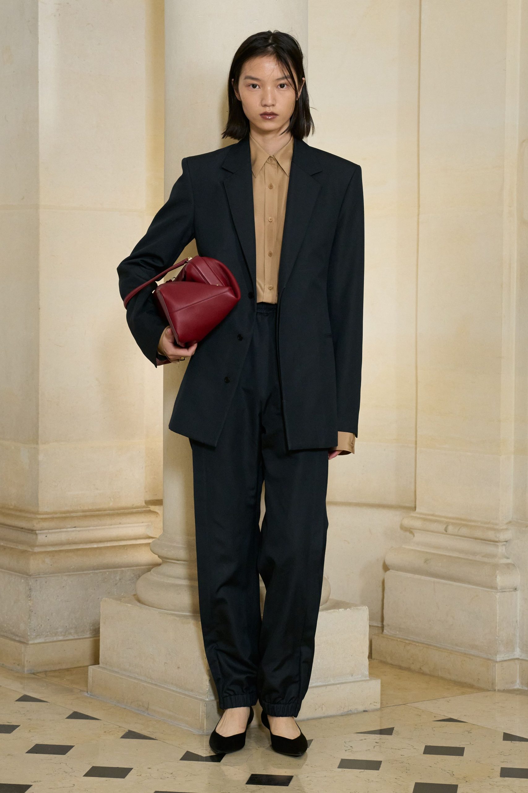 black tailored blazer with beige shirt