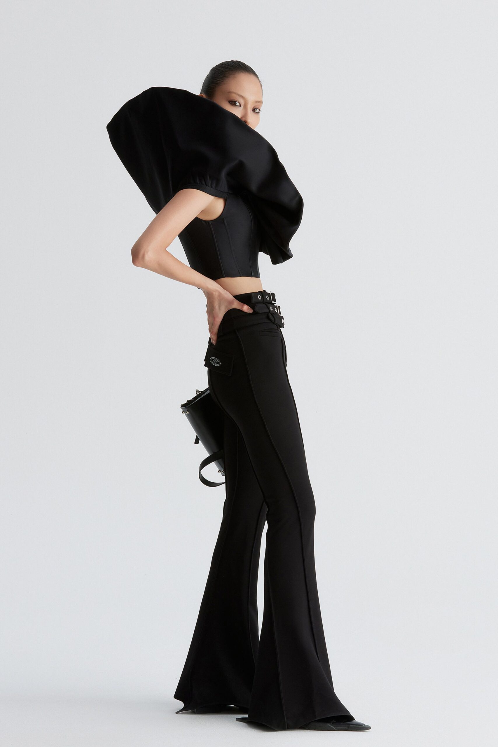 black fitted top and flared pants