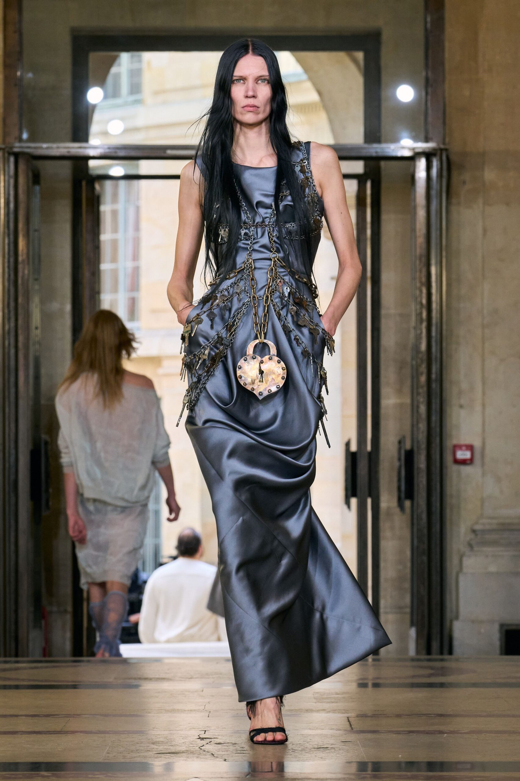 gray silk sleeveless v-neck fitted draped pockets gown