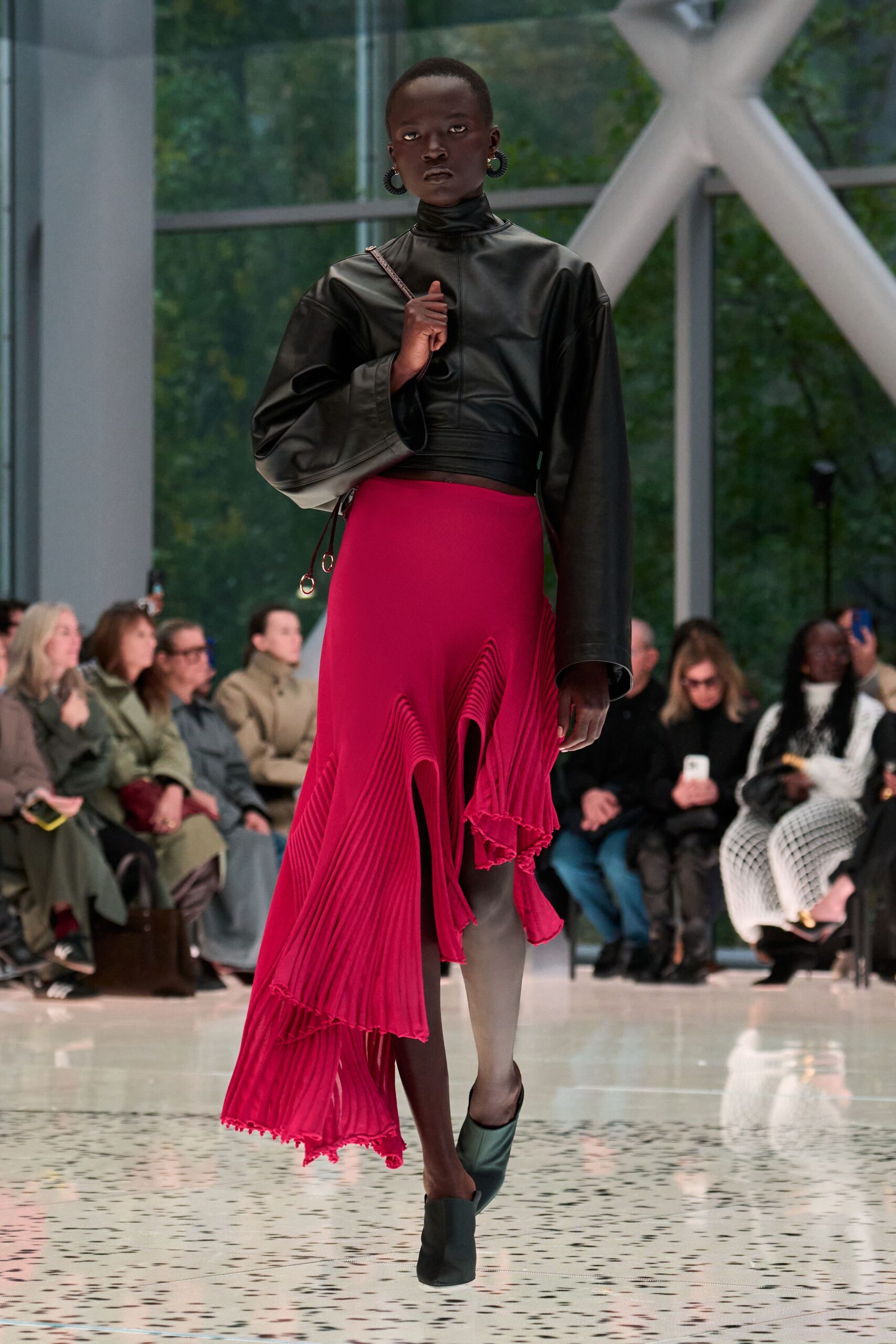 black leather top with red pleated skirt