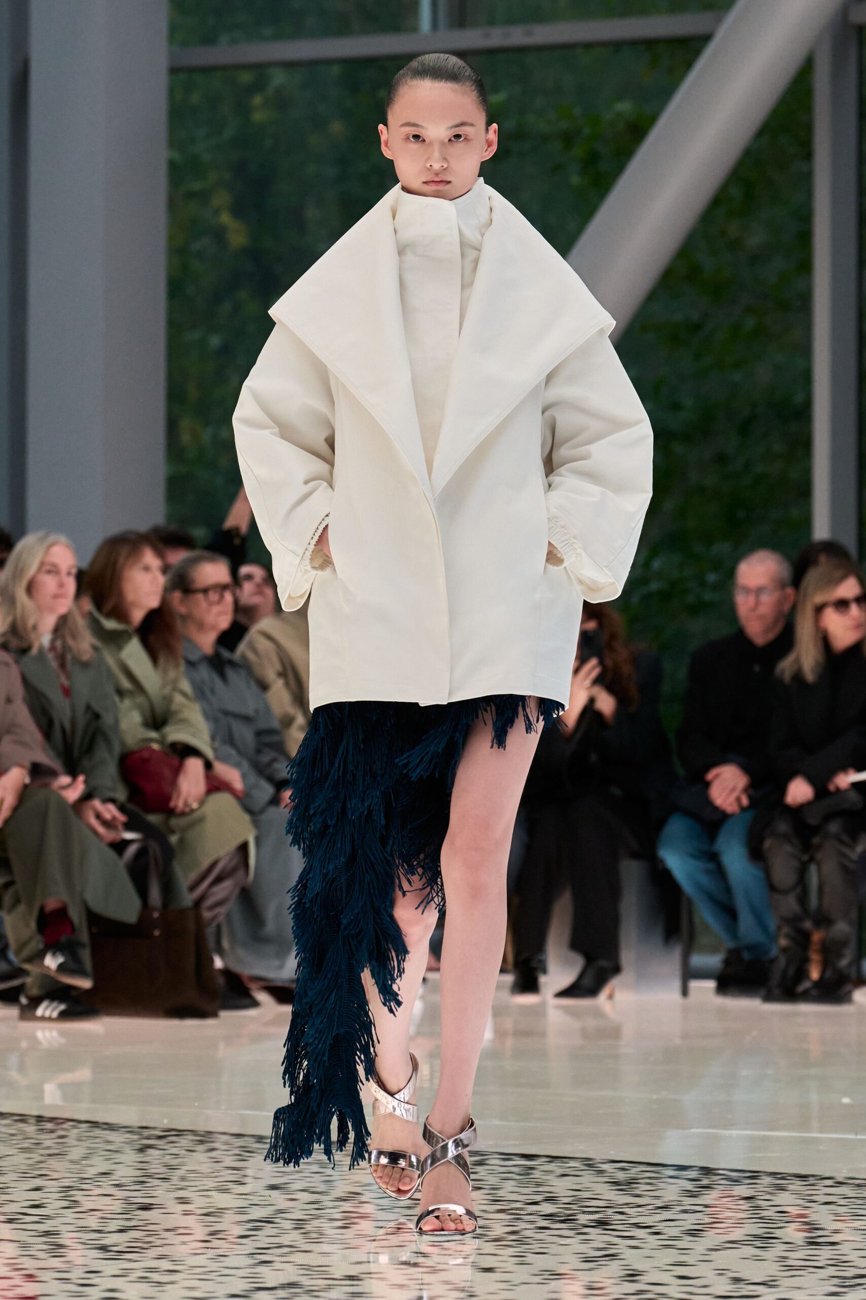 white oversized coat with blue fringed skirt