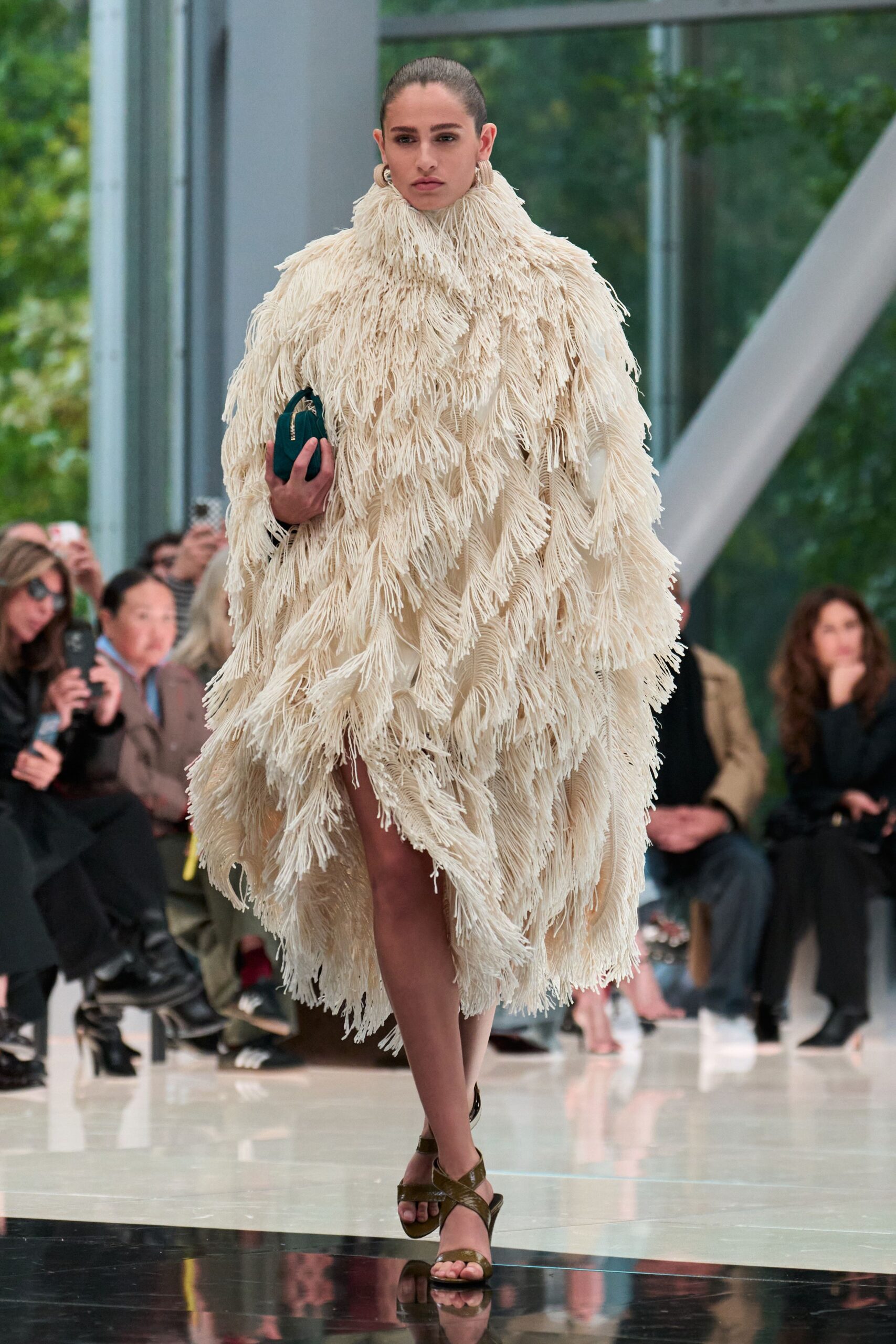 white fringed cape with brown shoes