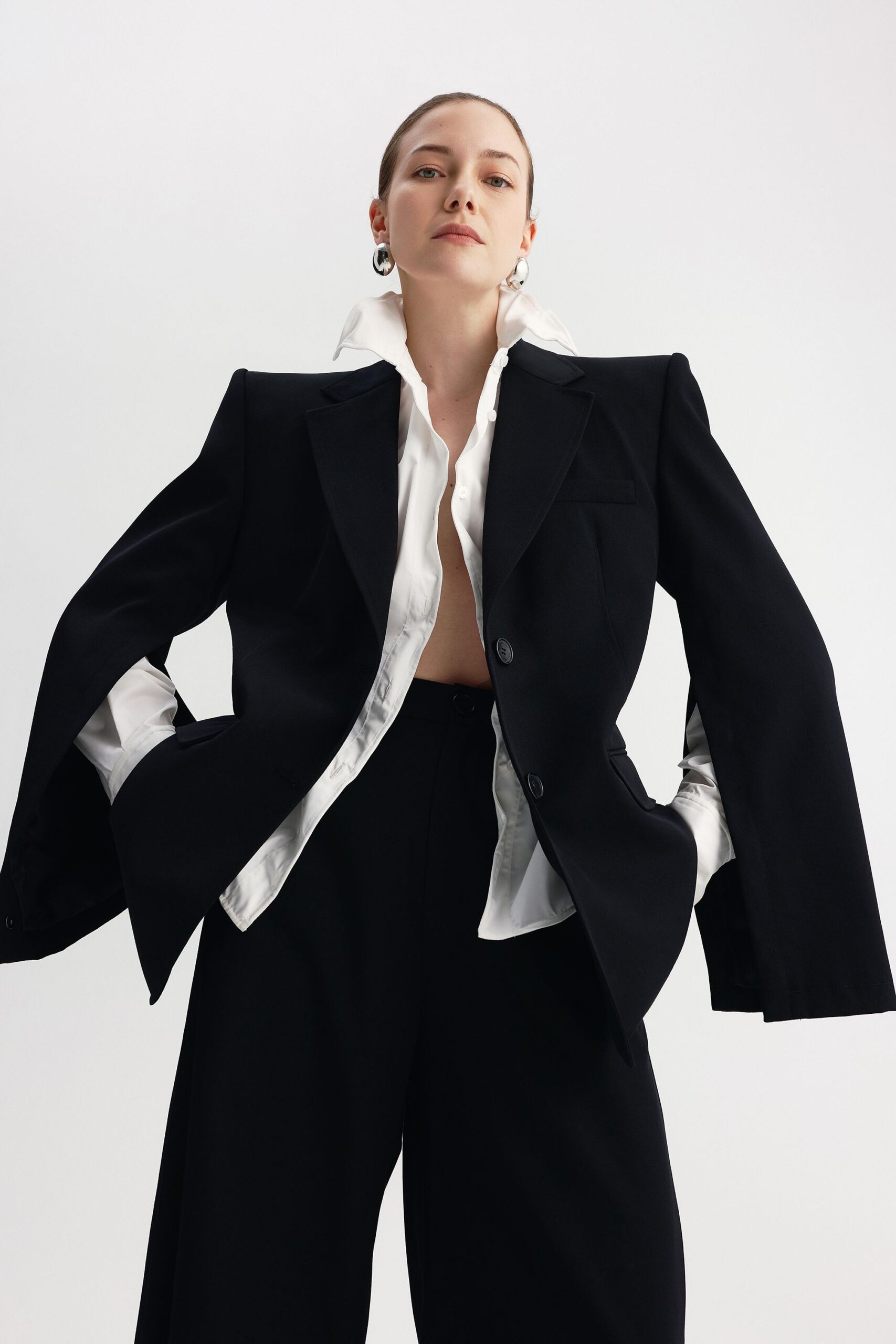 black blazer white shirt relaxed pants