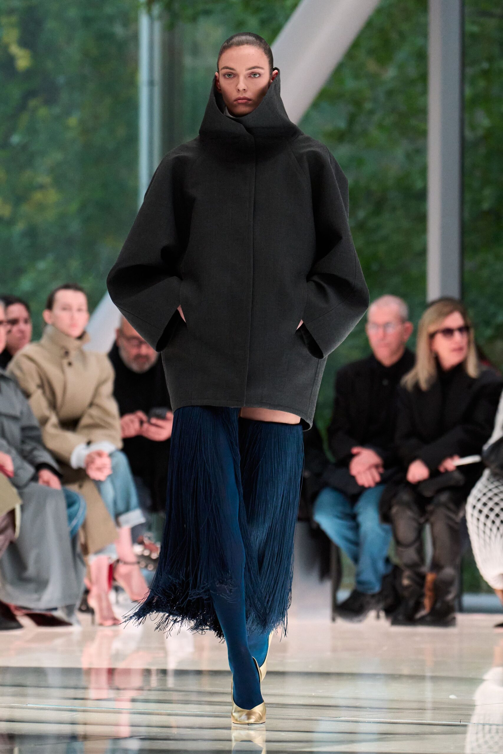 black oversized coat with fringed skirt