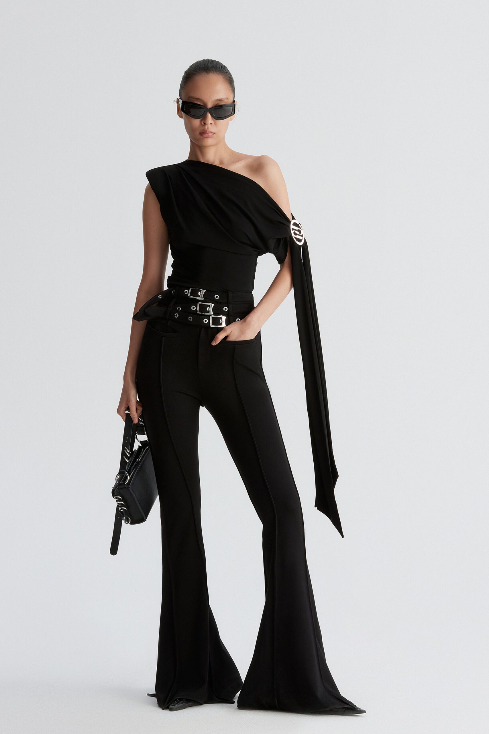 black one-shoulder top and flared pants