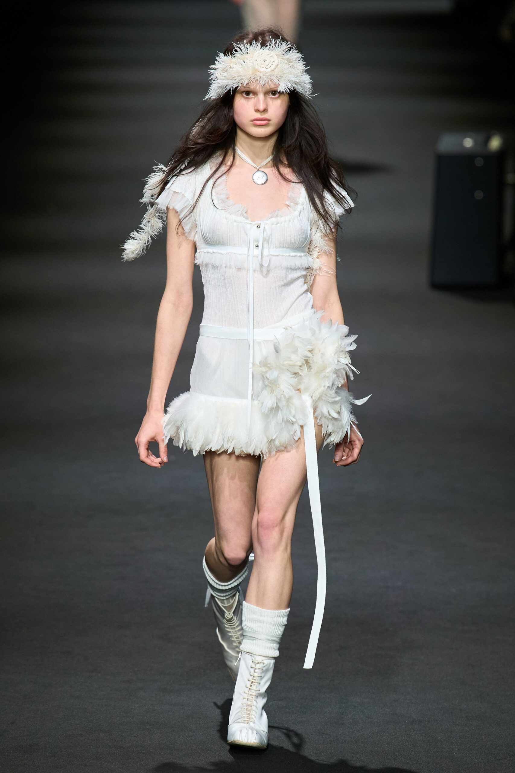 white fitted mini dress with feathers